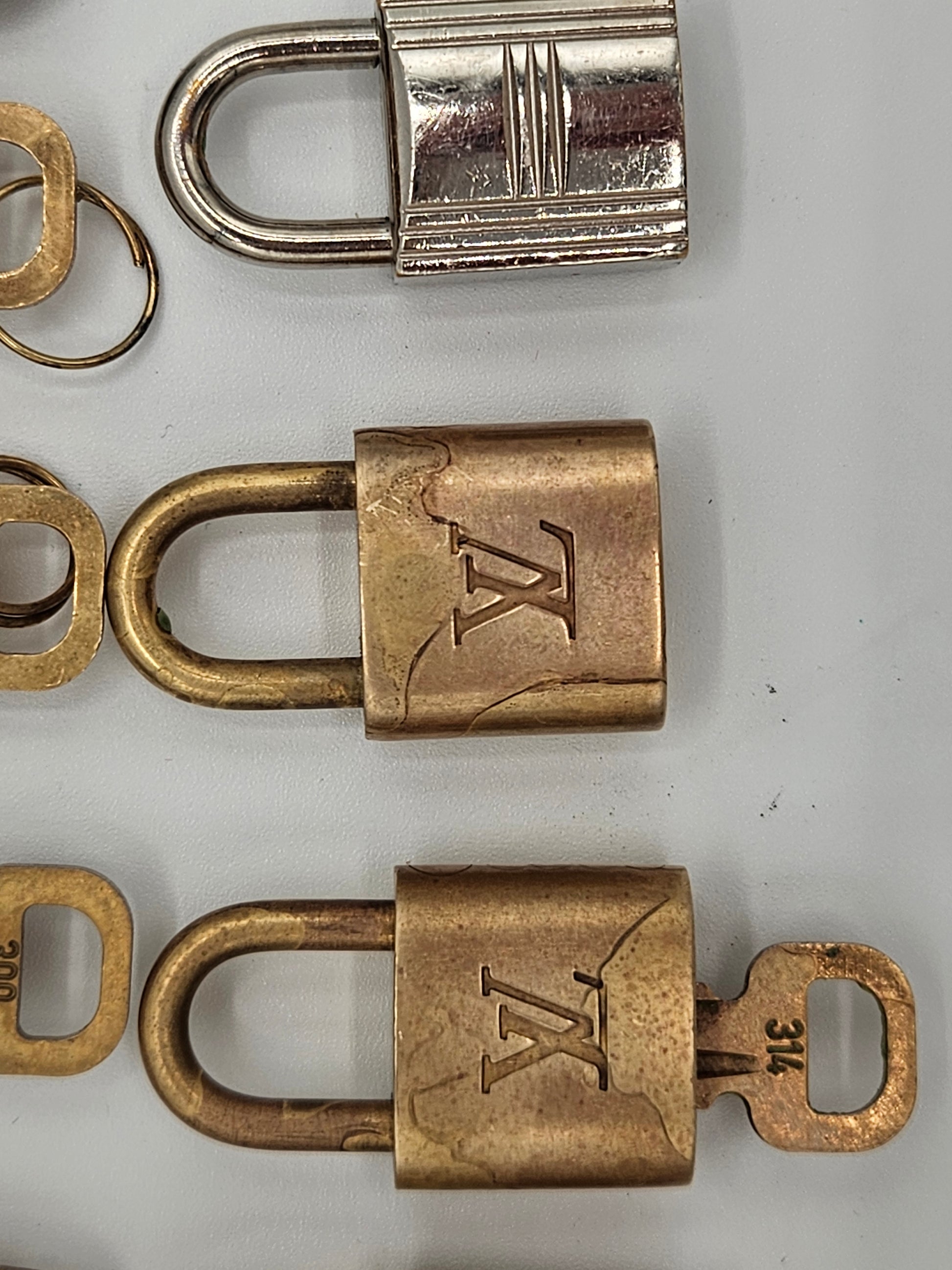 Three padlocks with different designs on a gray background