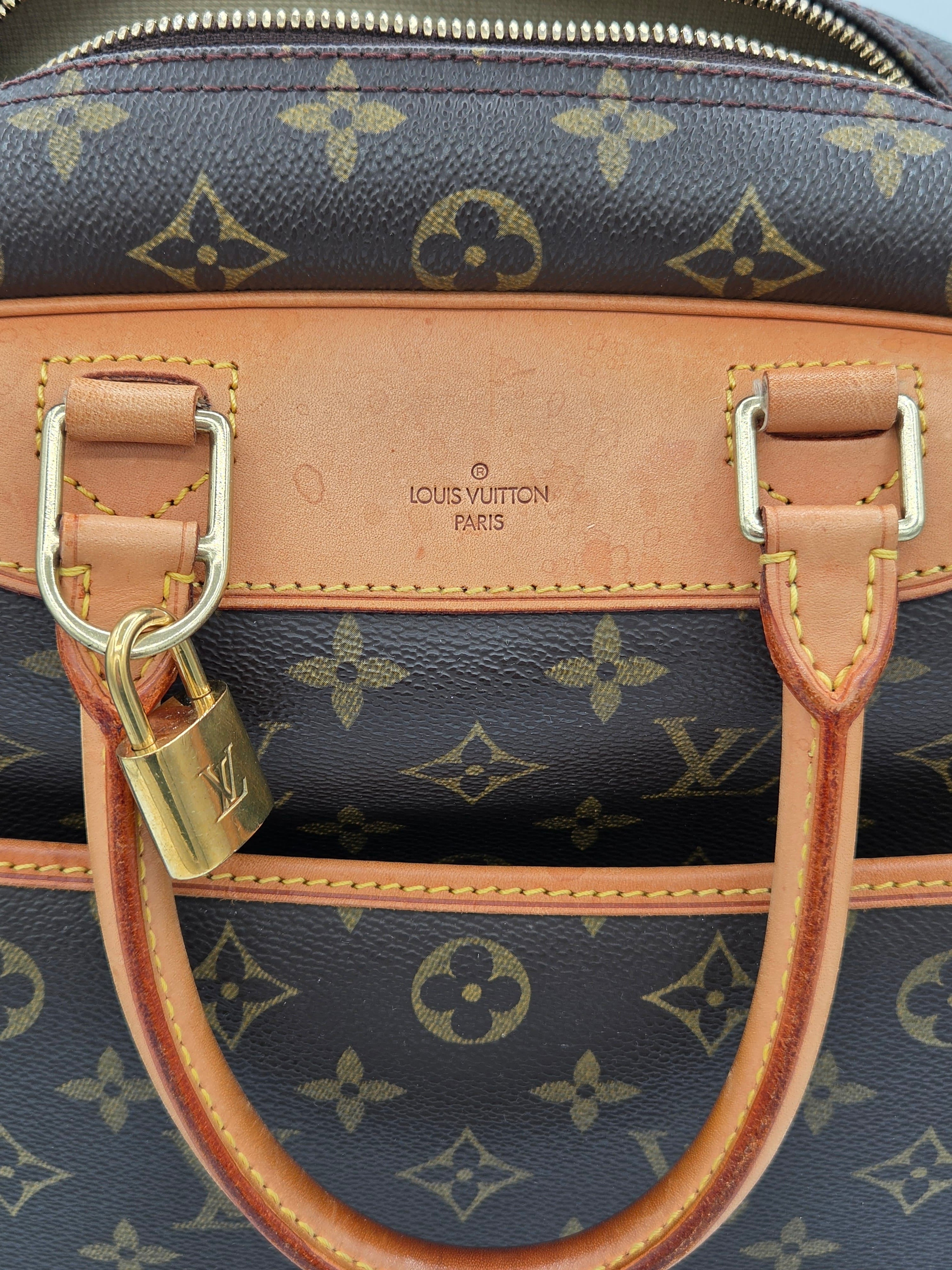 Close-up of a Louis Vuitton handbag with monogram pattern and visible brand logo.