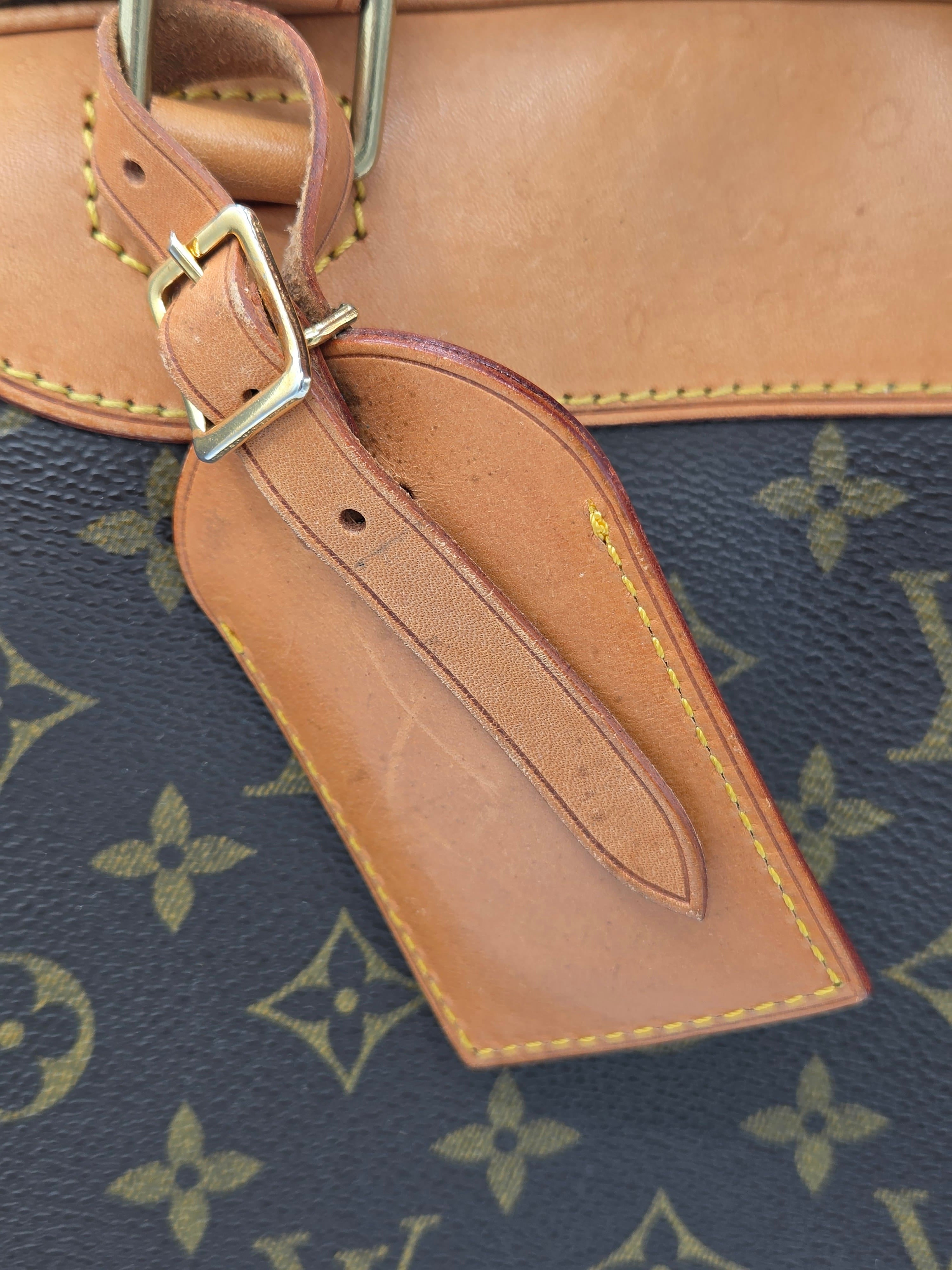 Close-up of a brown leather strap on a patterned background