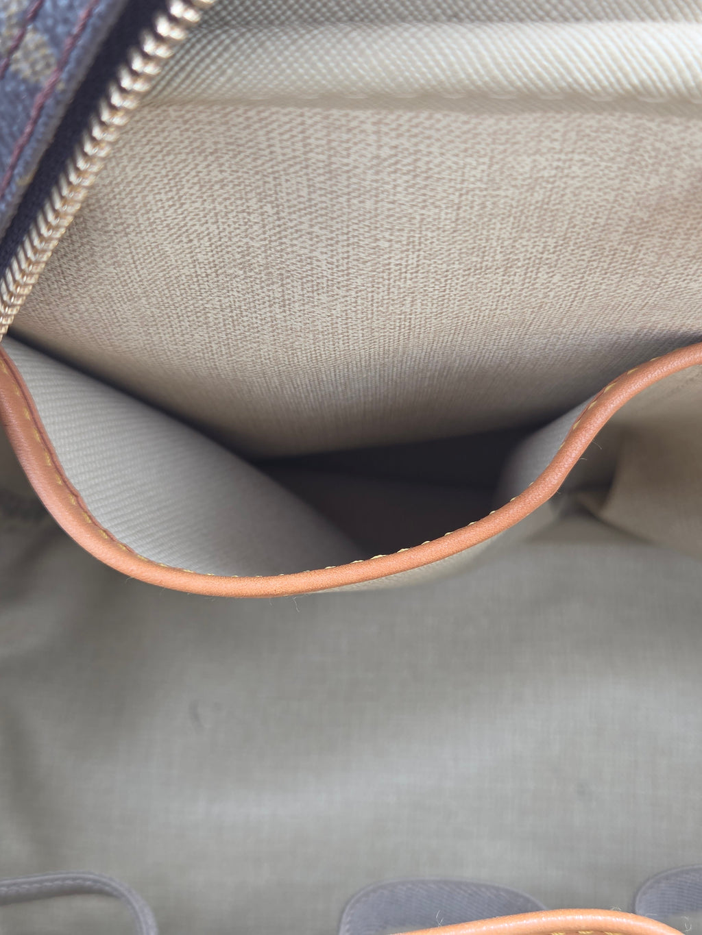Close-up of a textured fabric surface with a zipper