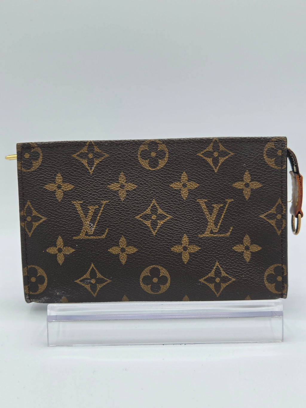 Designer notebook with monogram pattern on a light gray background