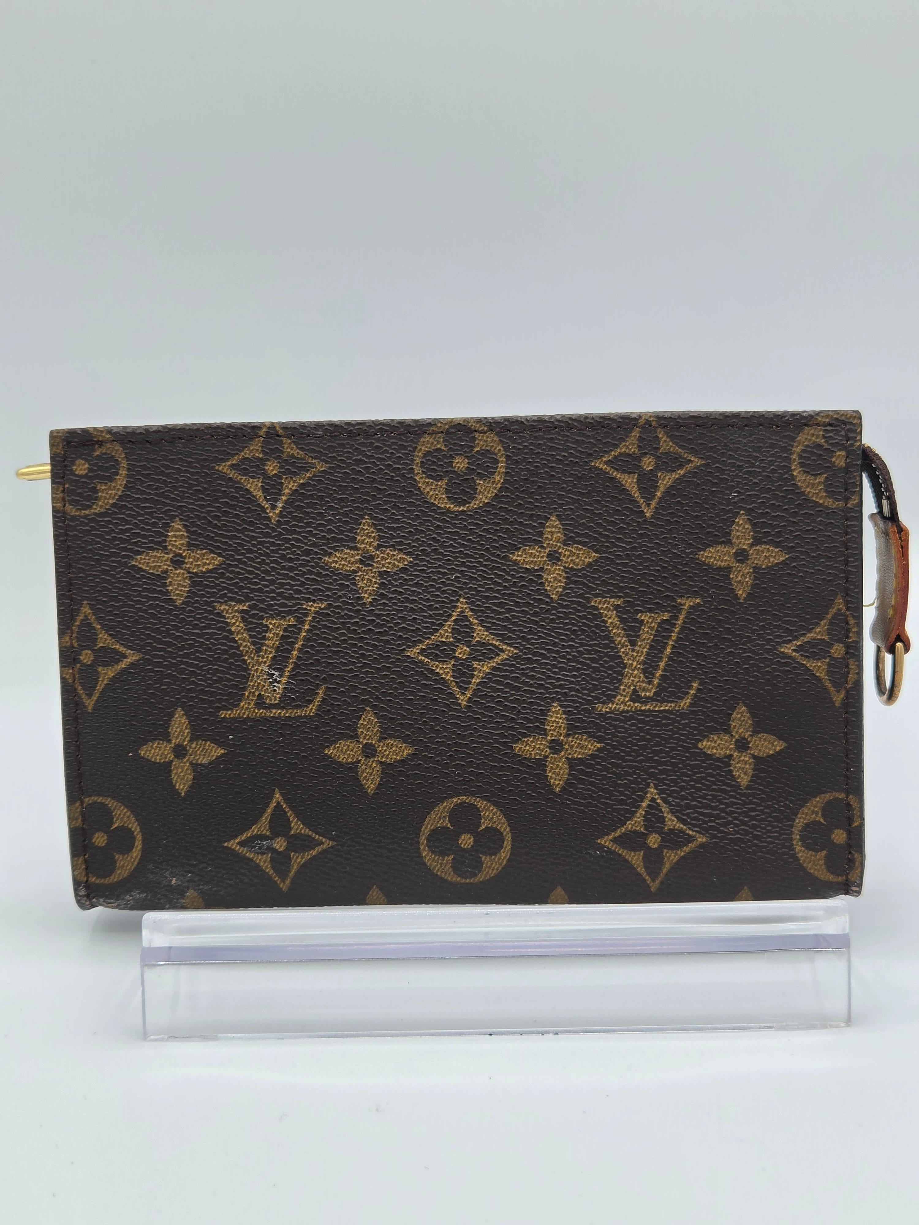 Designer notebook with monogram pattern on a light gray background