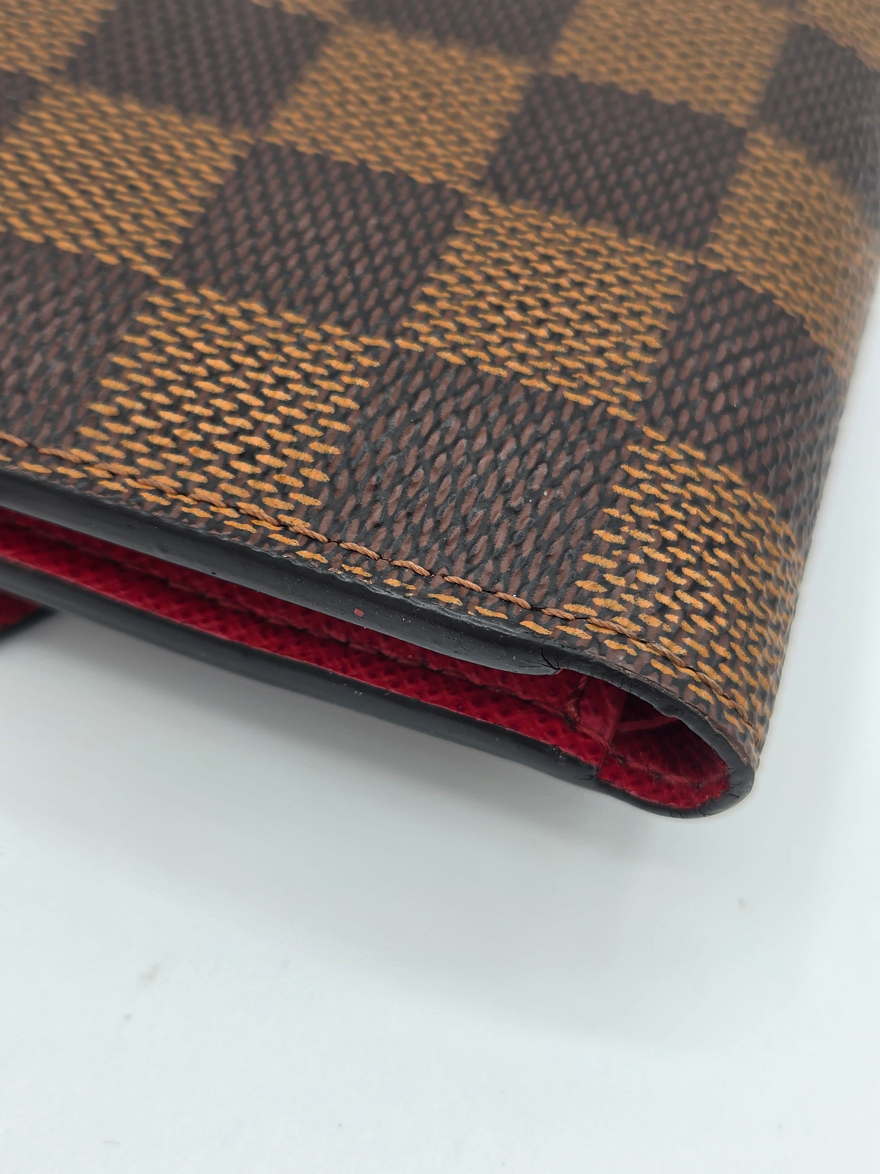 Close-up of a brown and red checkered fabric with a white background