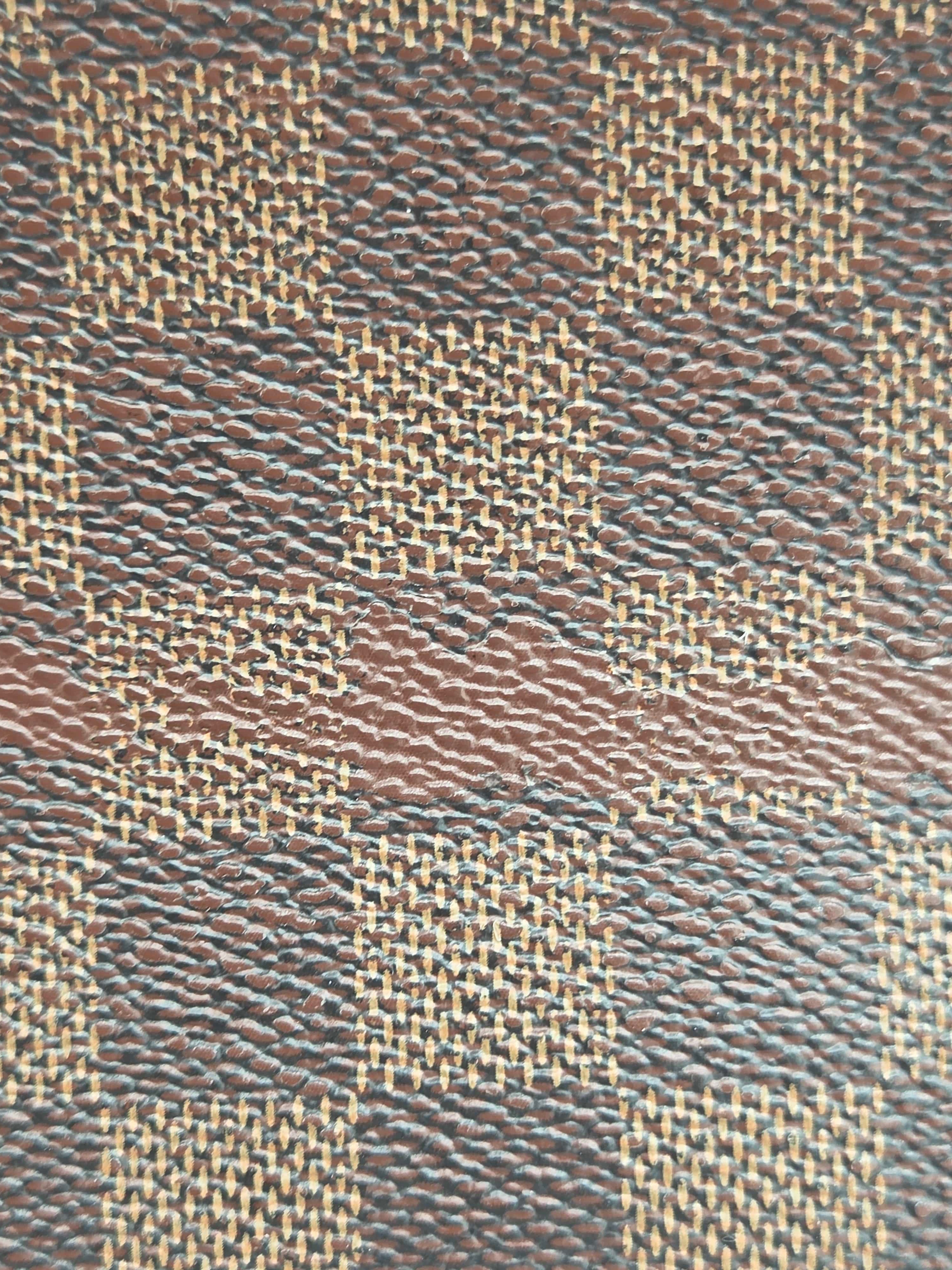 Close-up of a woven fabric with brown and beige pattern