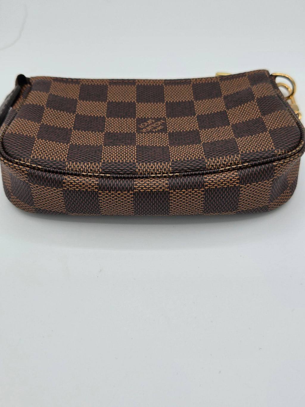 Brown checkered wallet on a white background