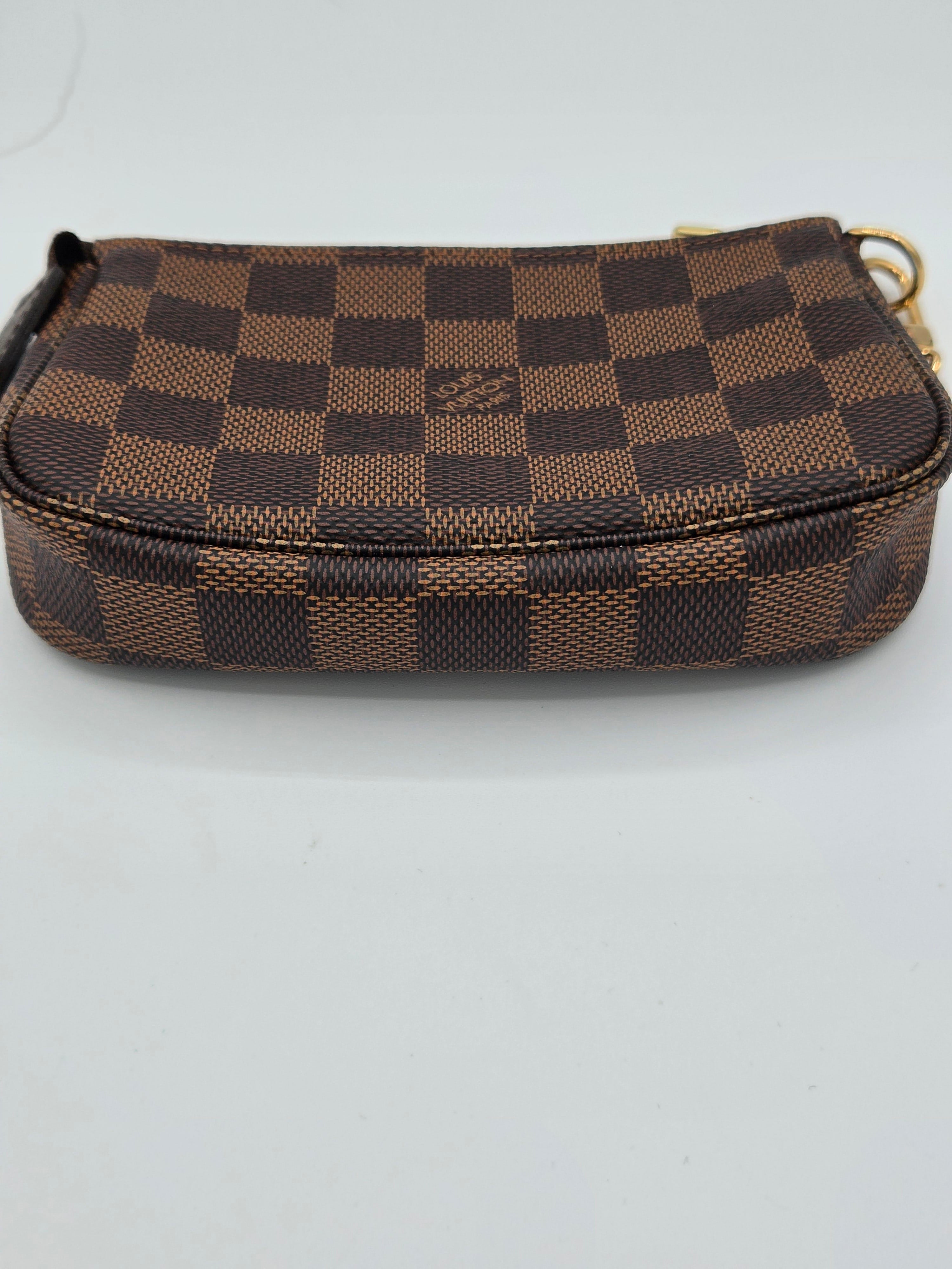 Brown checkered wallet on a white background