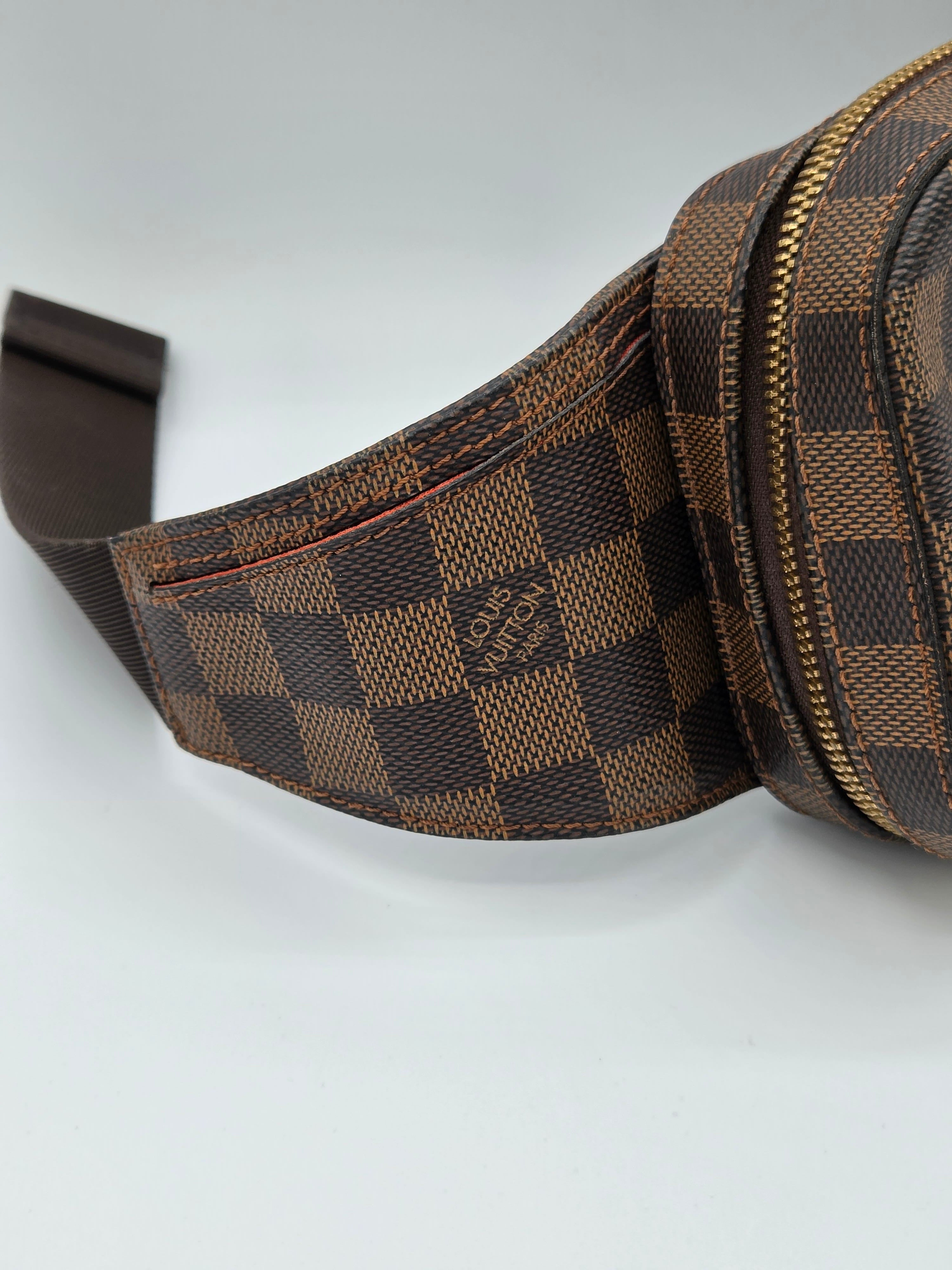 Brown checkered bag with visible brand logo on a light gray background