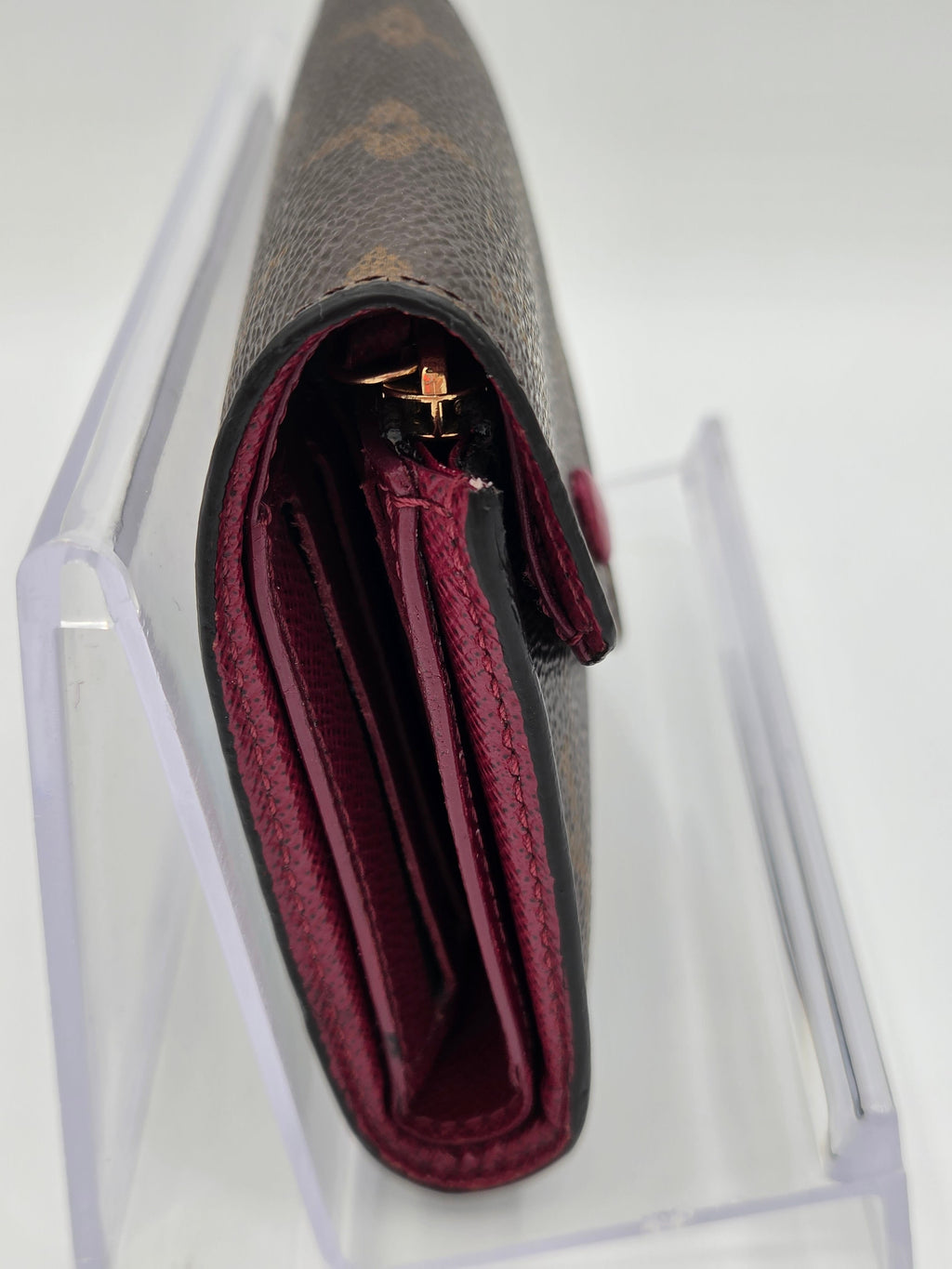 Close-up of a wallet with a clear plastic cover on a white background