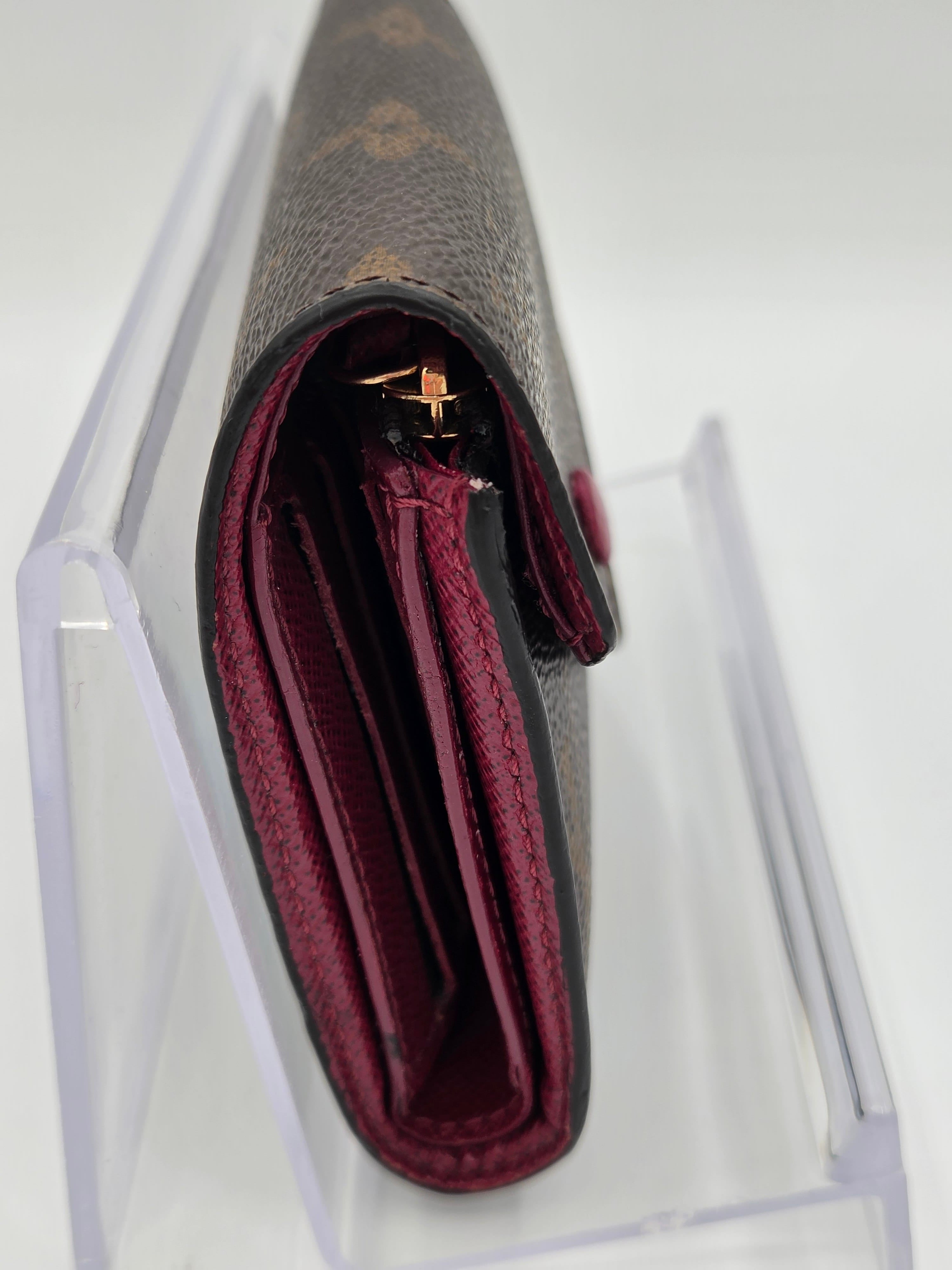 Close-up of a wallet with a clear plastic cover on a white background