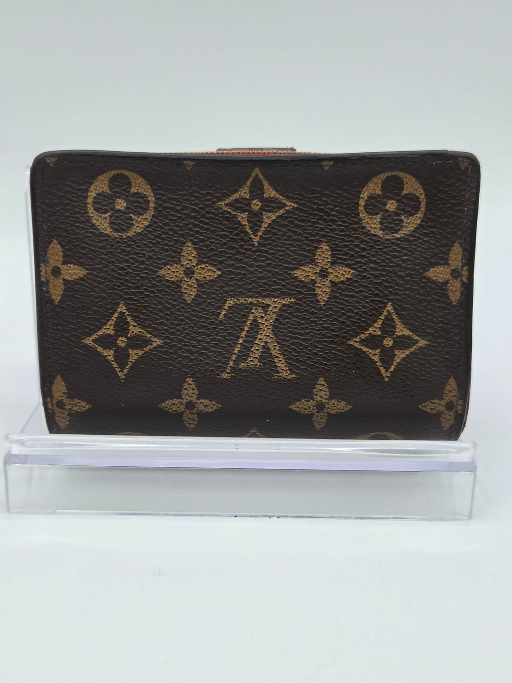 Designer wallet with monogram pattern on a white background