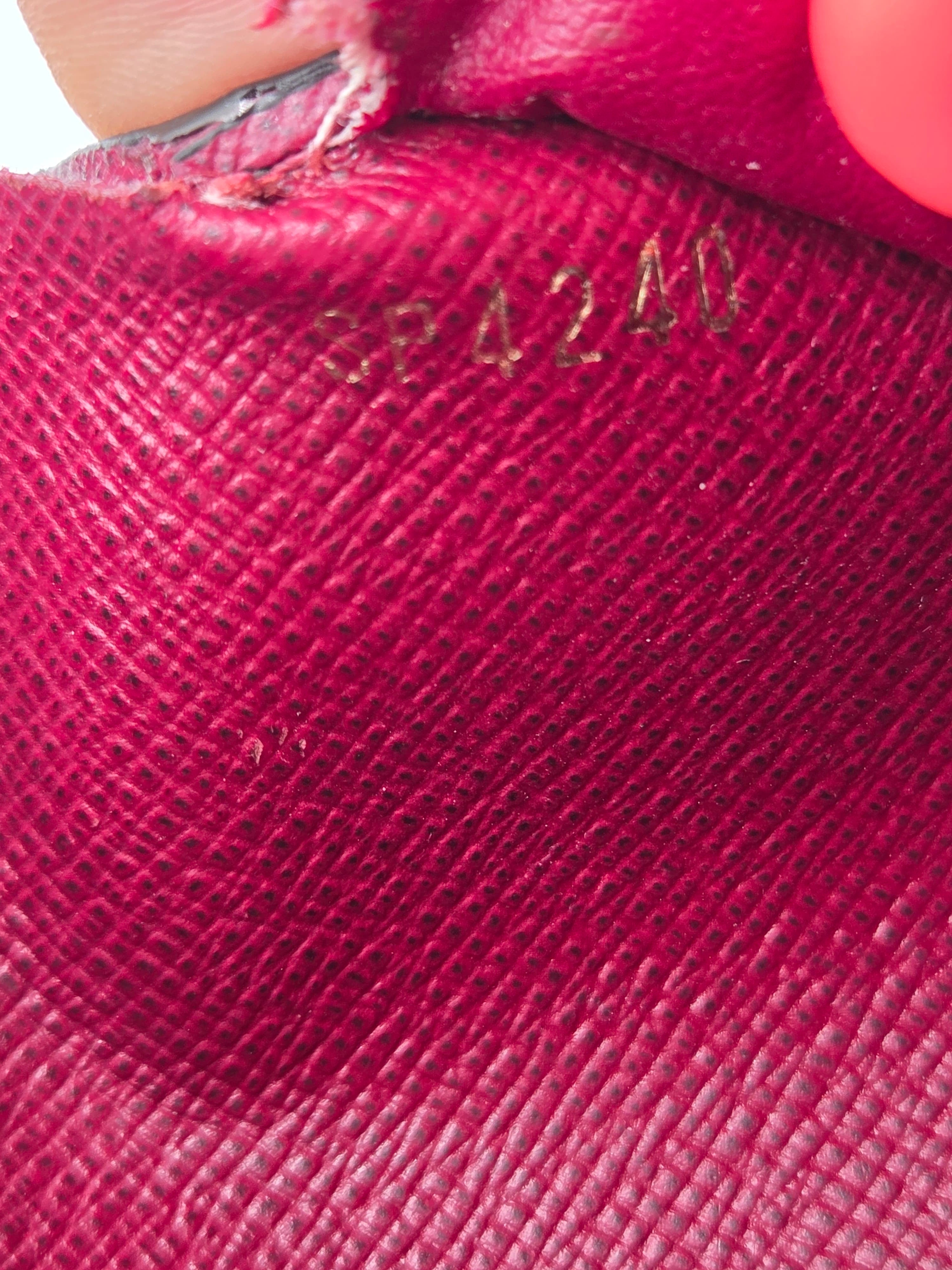 Close-up of a red textured surface with visible branding.
