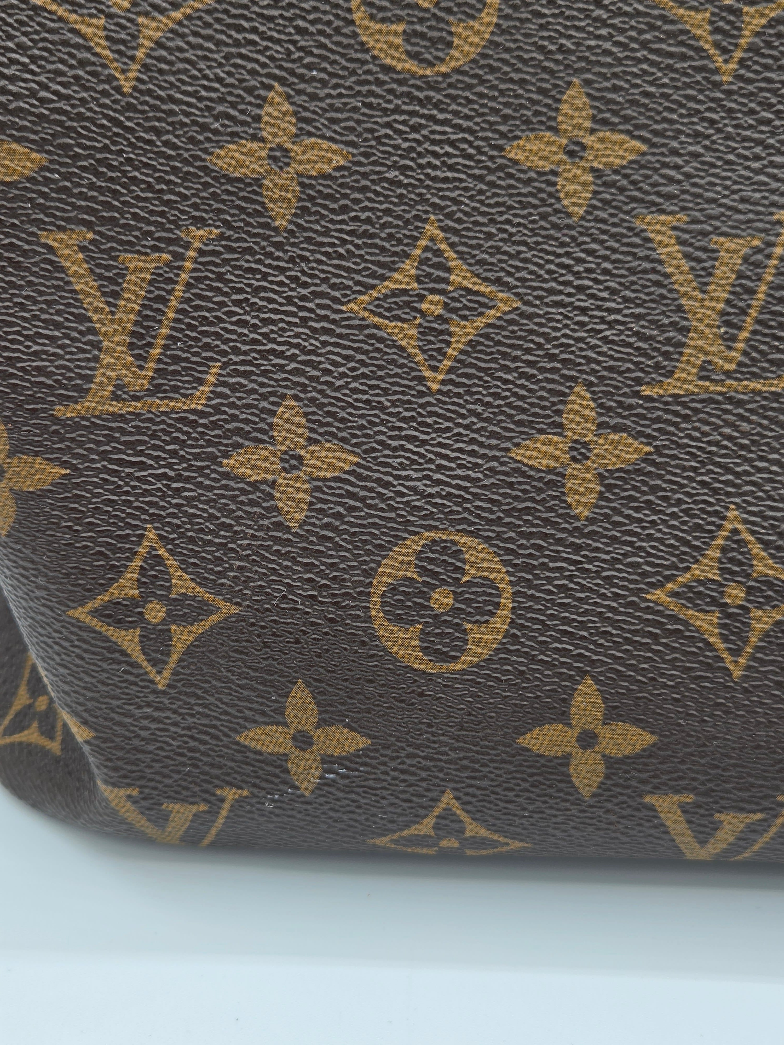 Close-up of a textured surface with a pattern resembling a famous brand logo.