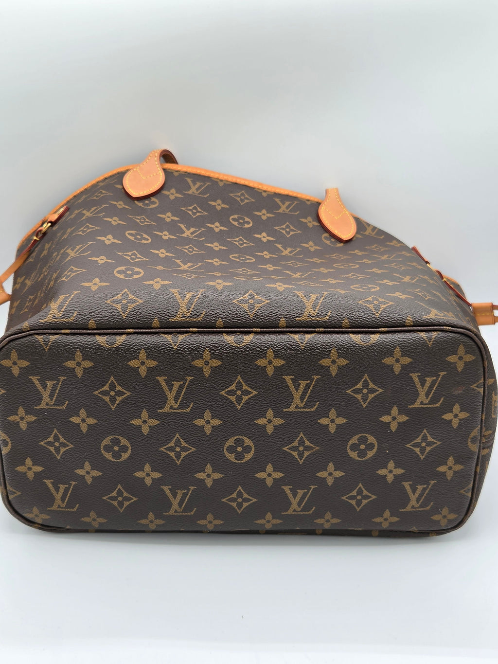 Louis Vuitton monogram bag on a light gray background