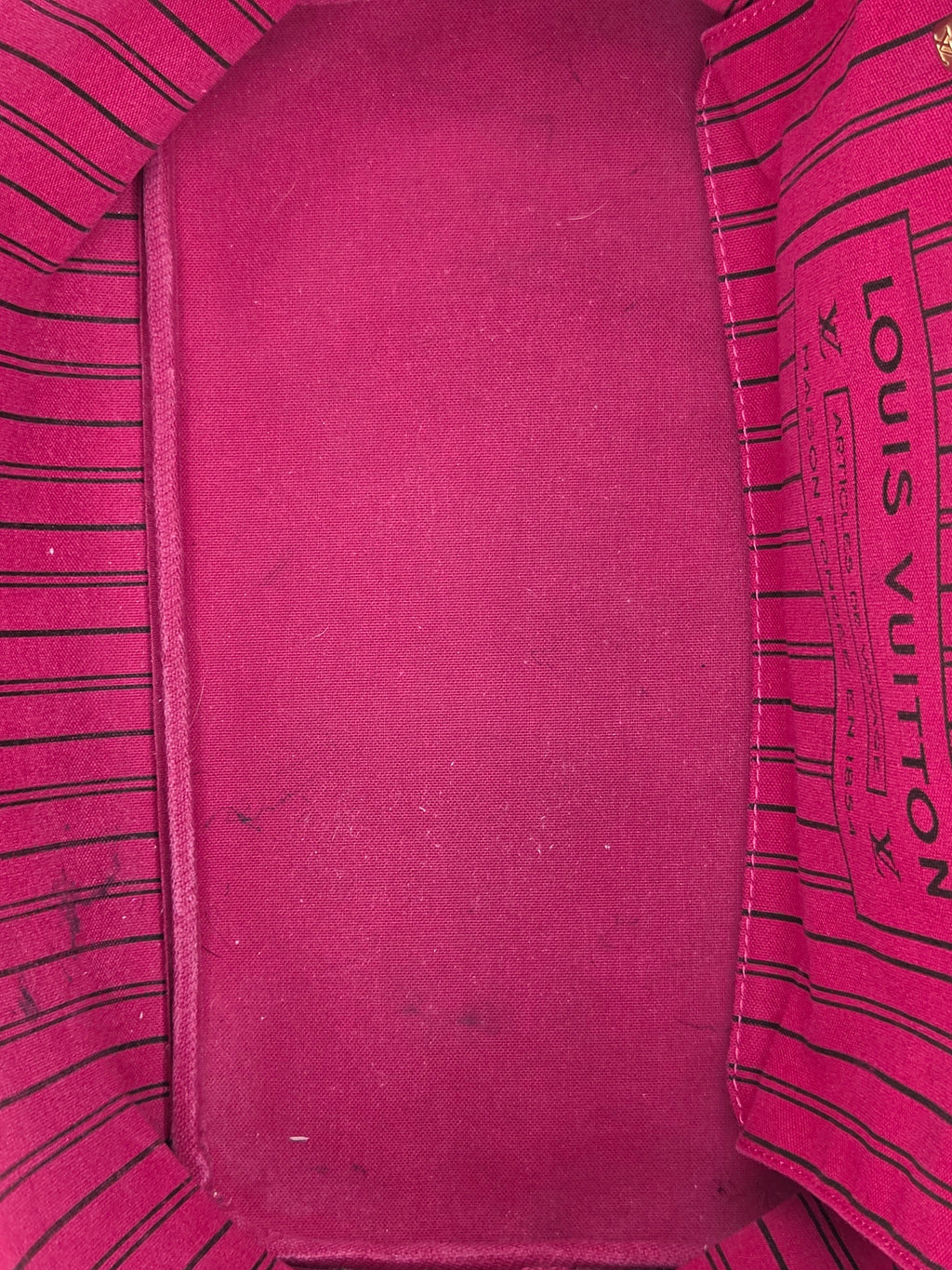 Close-up of a Louis Vuitton bag with visible branding.