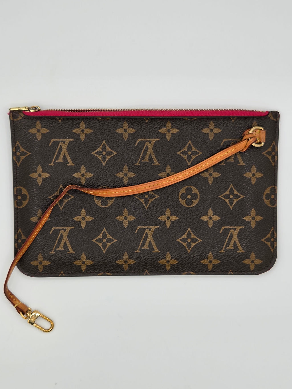 Designer handbag with monogram pattern on a light gray background