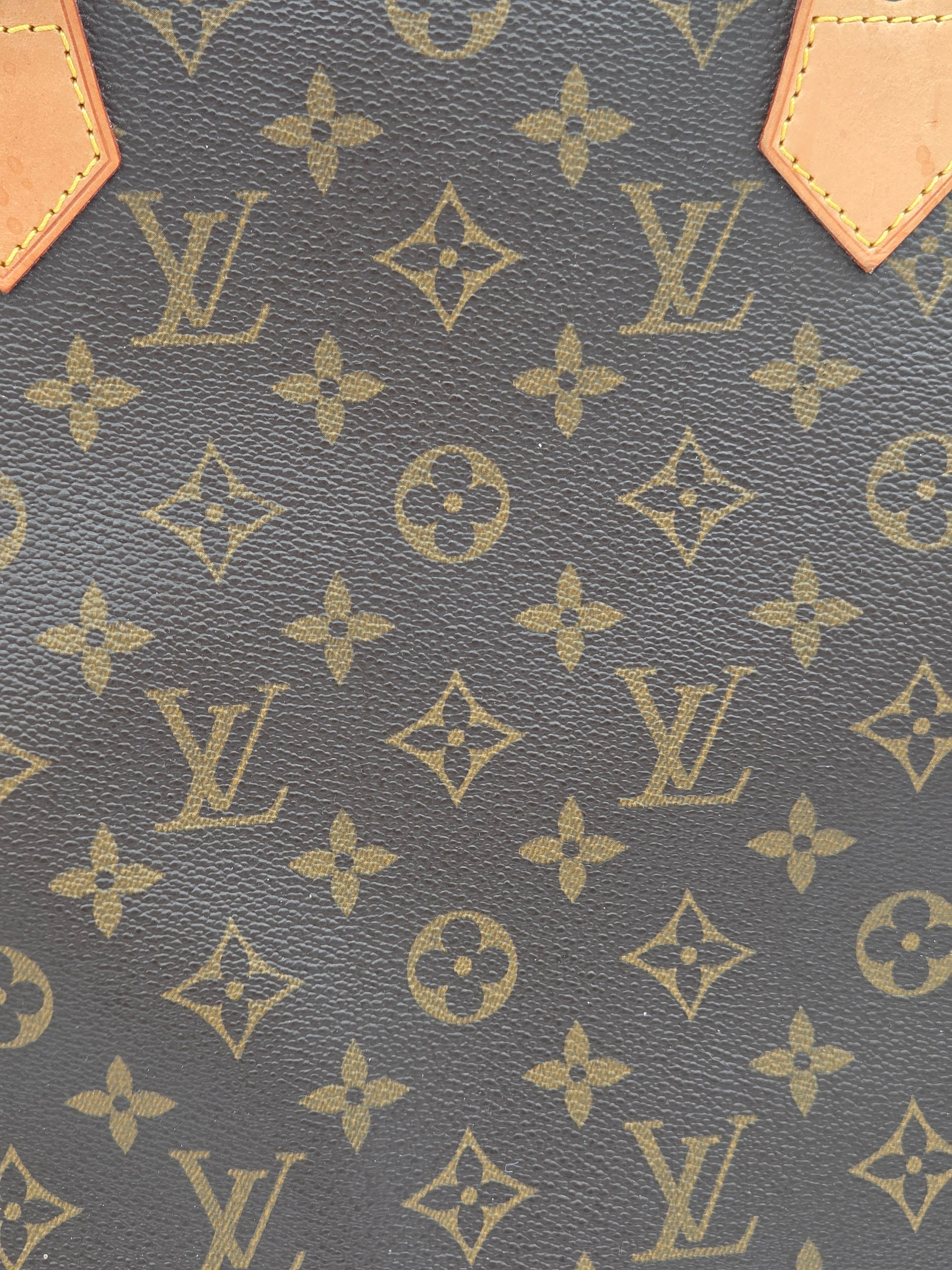 Close-up of a patterned fabric with brand logo and geometric design.