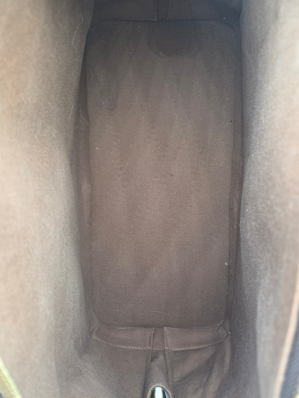 Close-up of a car seat with a visible stain.