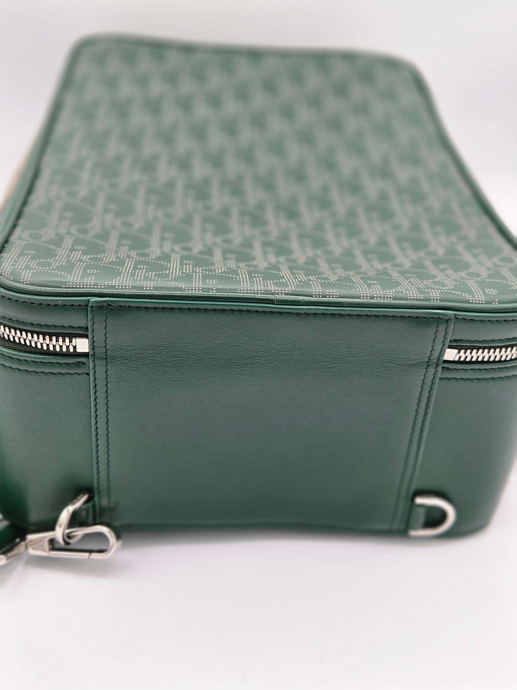 Green leather bag with zipper on a white background