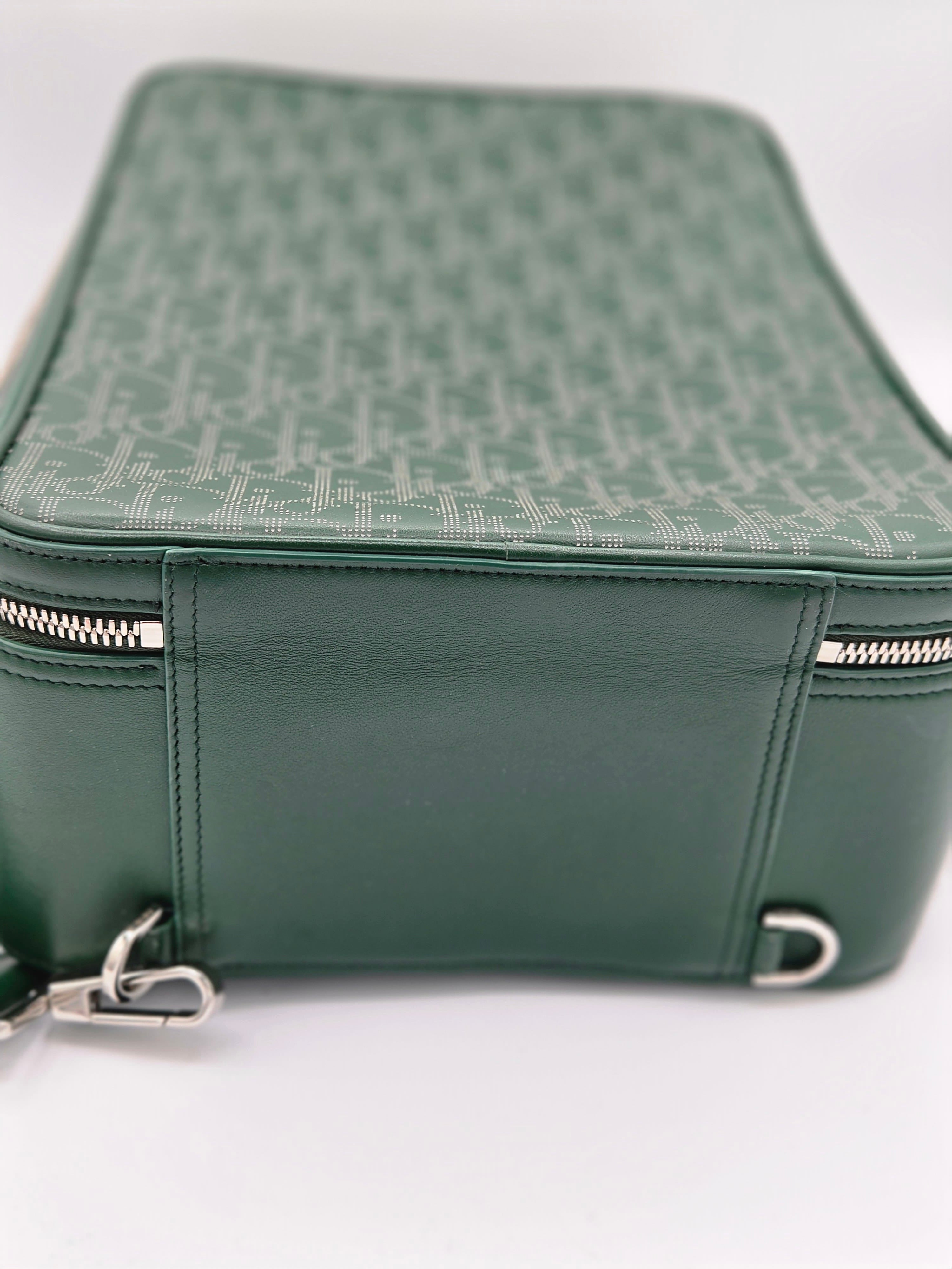 Green leather bag with zipper on a white background