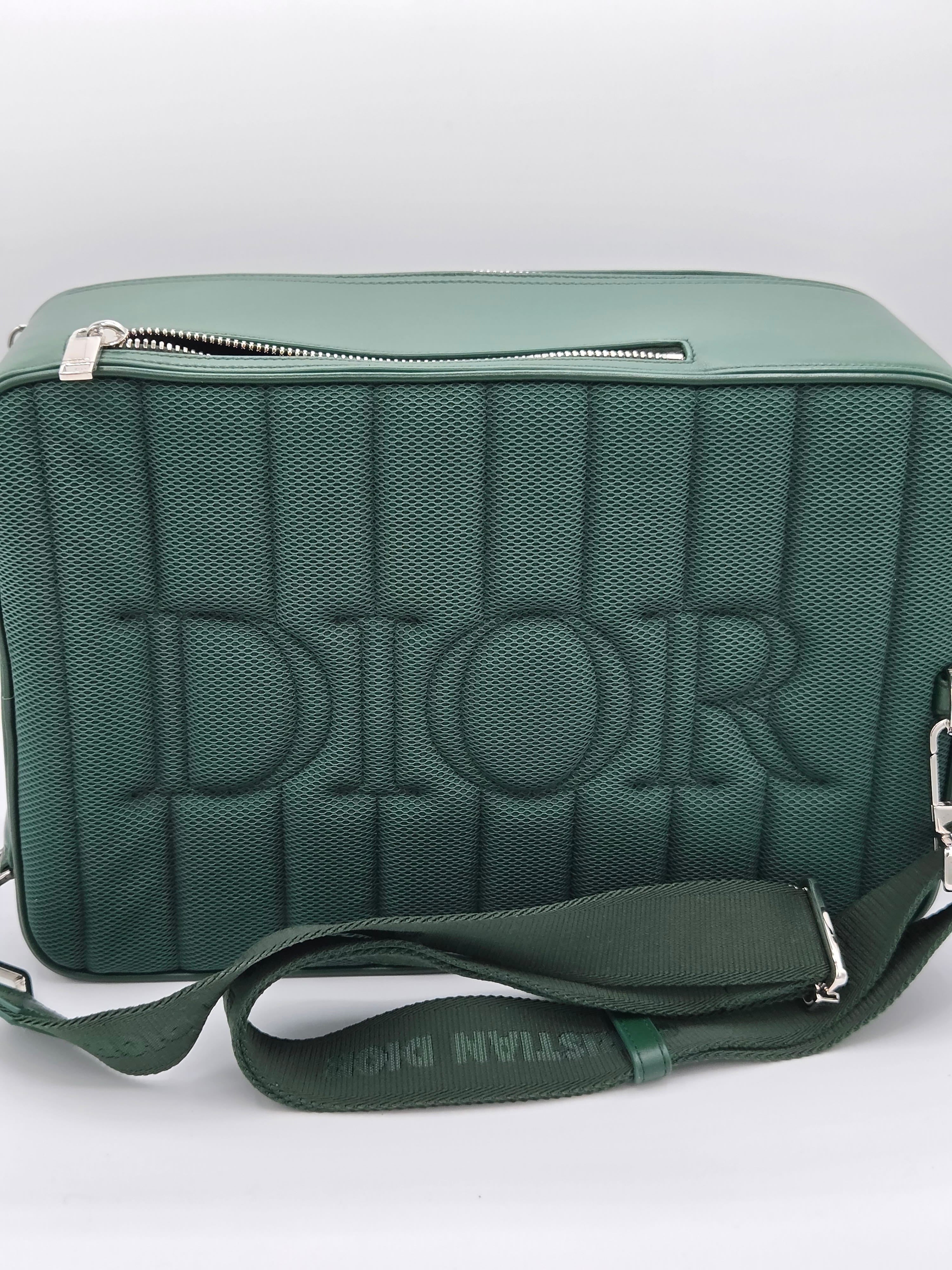 Green bag with 'Dior' branding on a white background