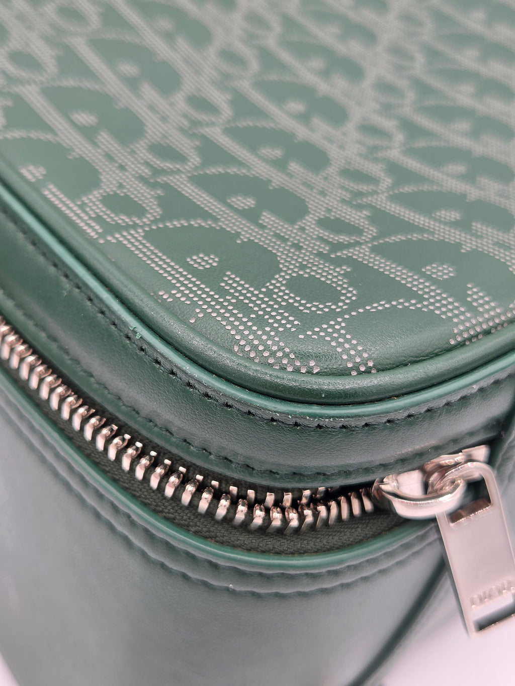 Close-up of a green textured bag with a zipper