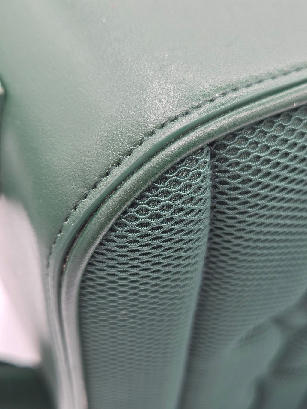 Close-up of a green cushion with mesh material