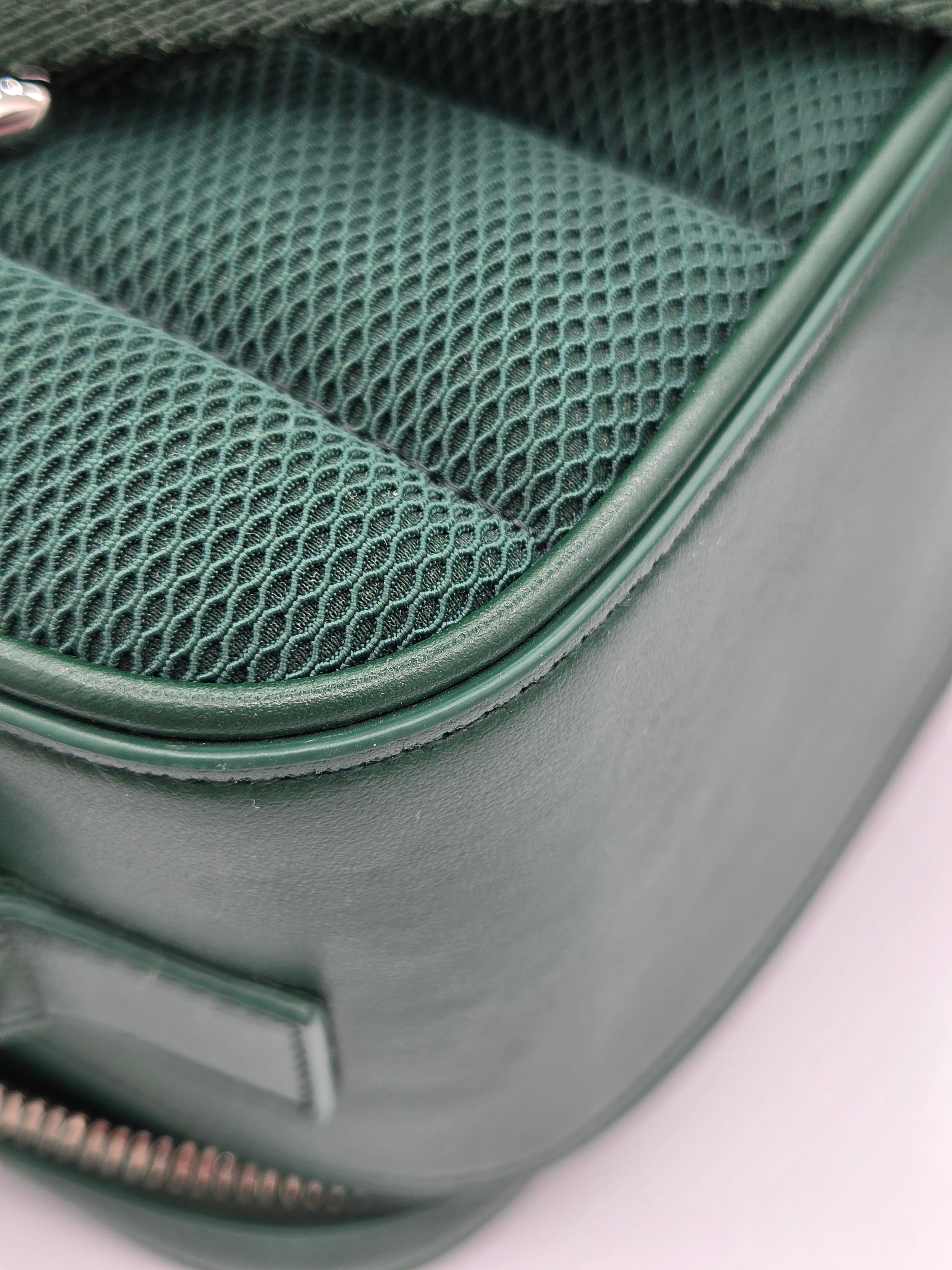 Close-up of a green car seat with mesh design