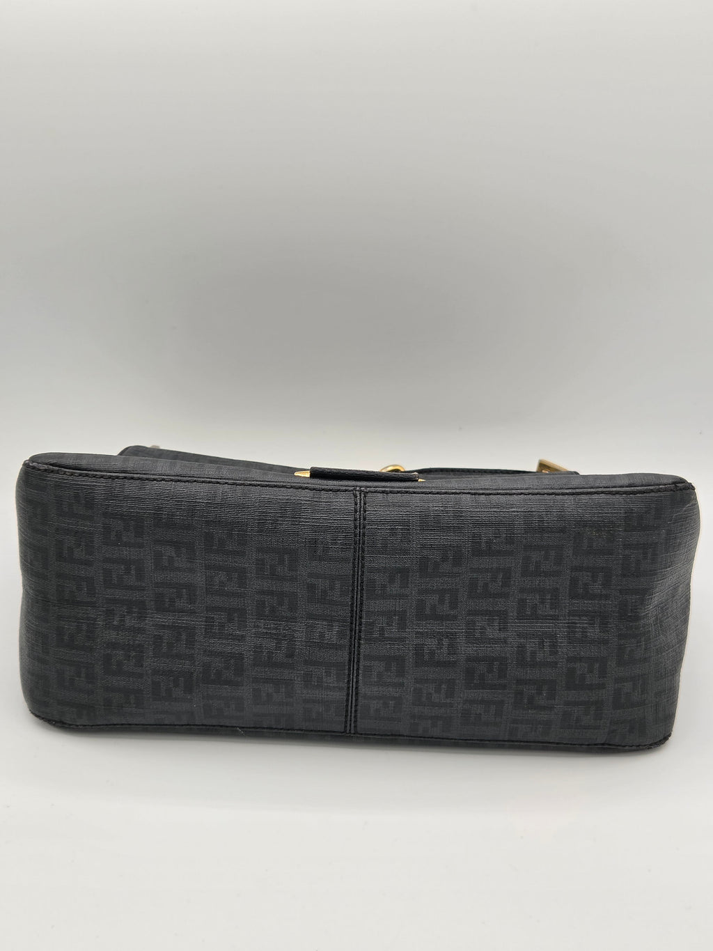 Black patterned wallet on a light gray background