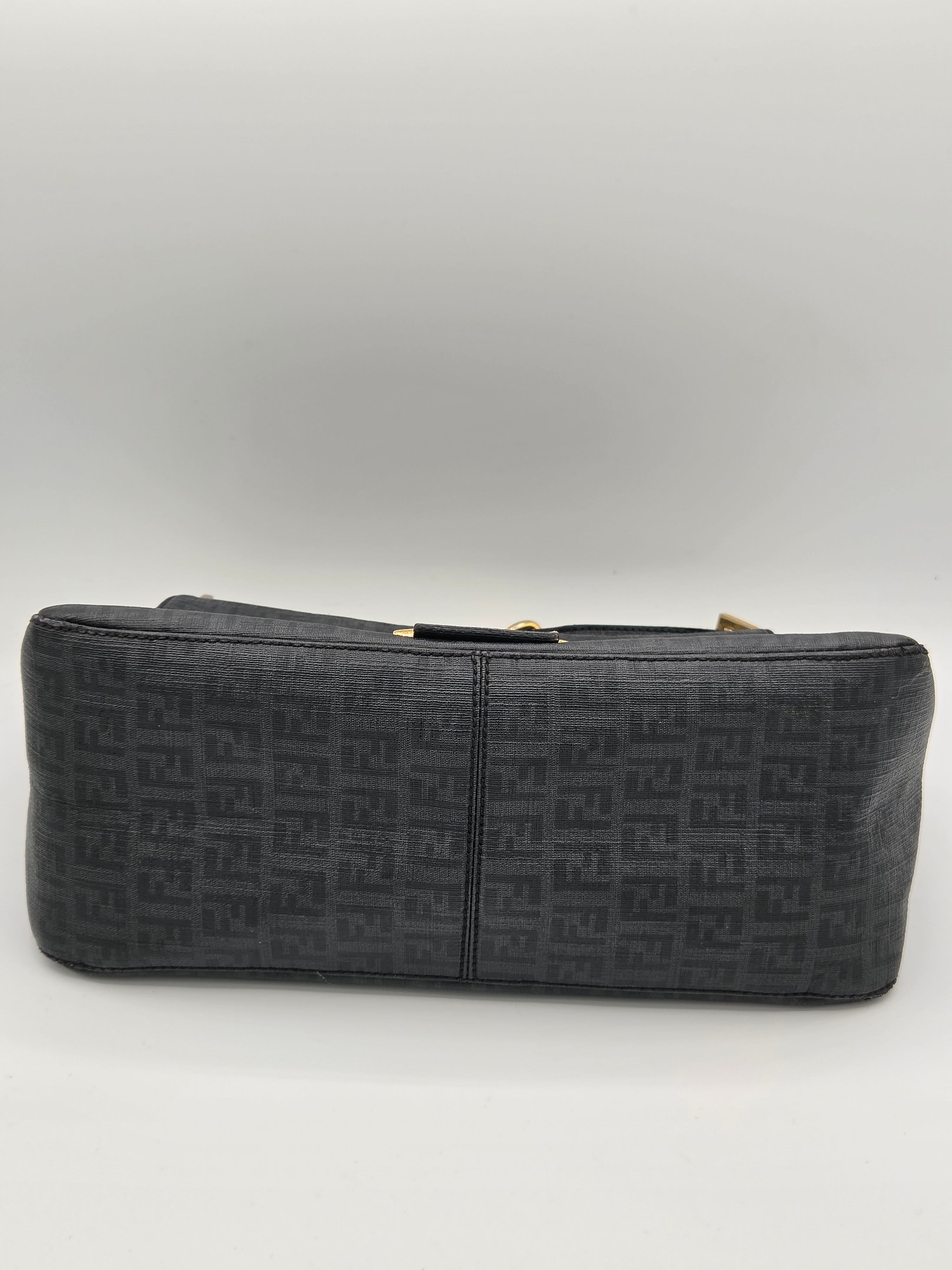 Black patterned wallet on a light gray background