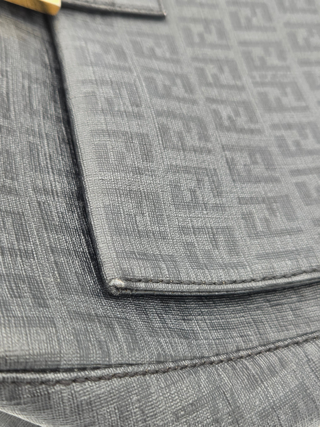 Close-up of a textured gray fabric with a patterned design