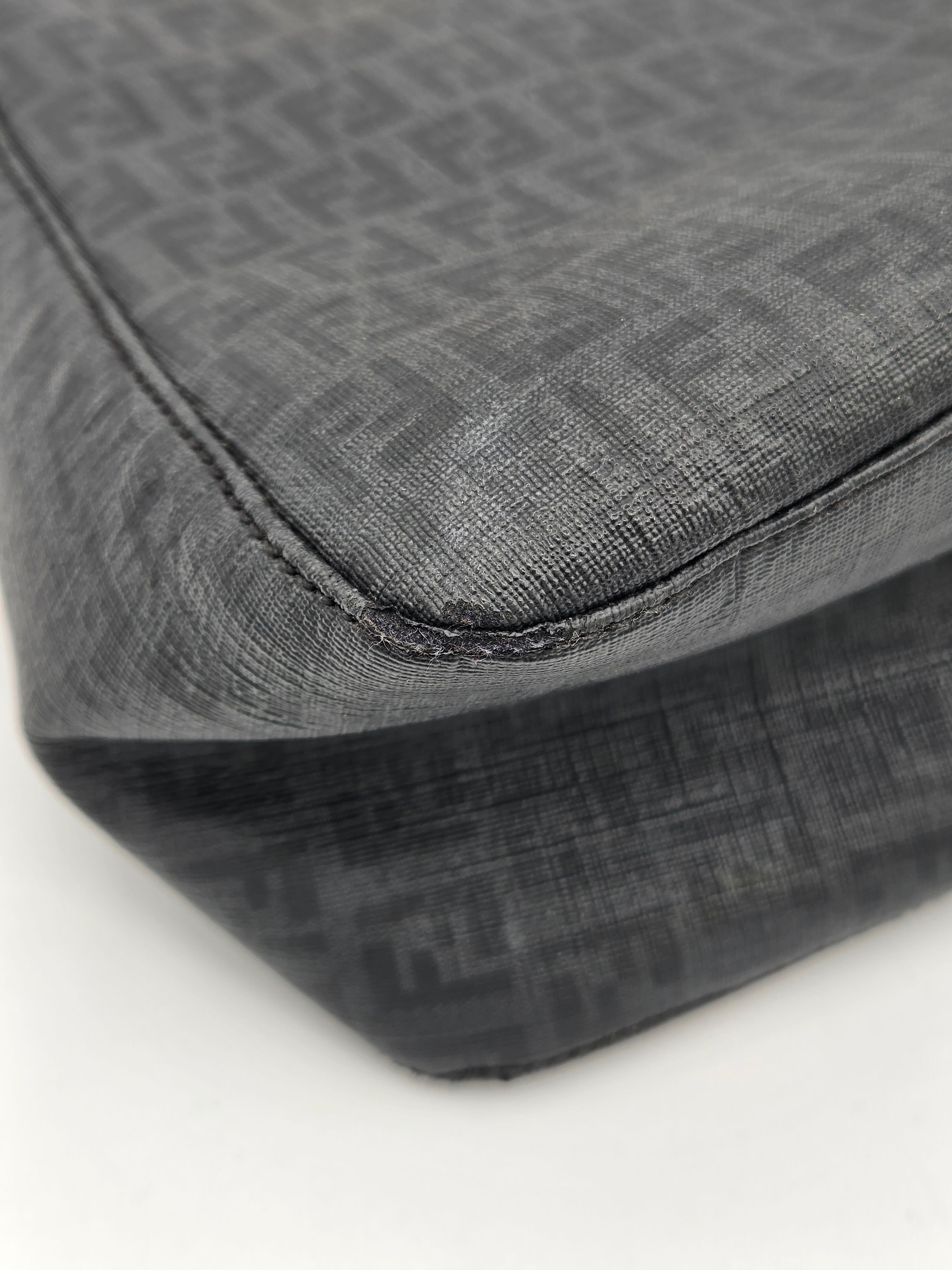 Close-up of a textured gray fabric with a subtle pattern on a white background