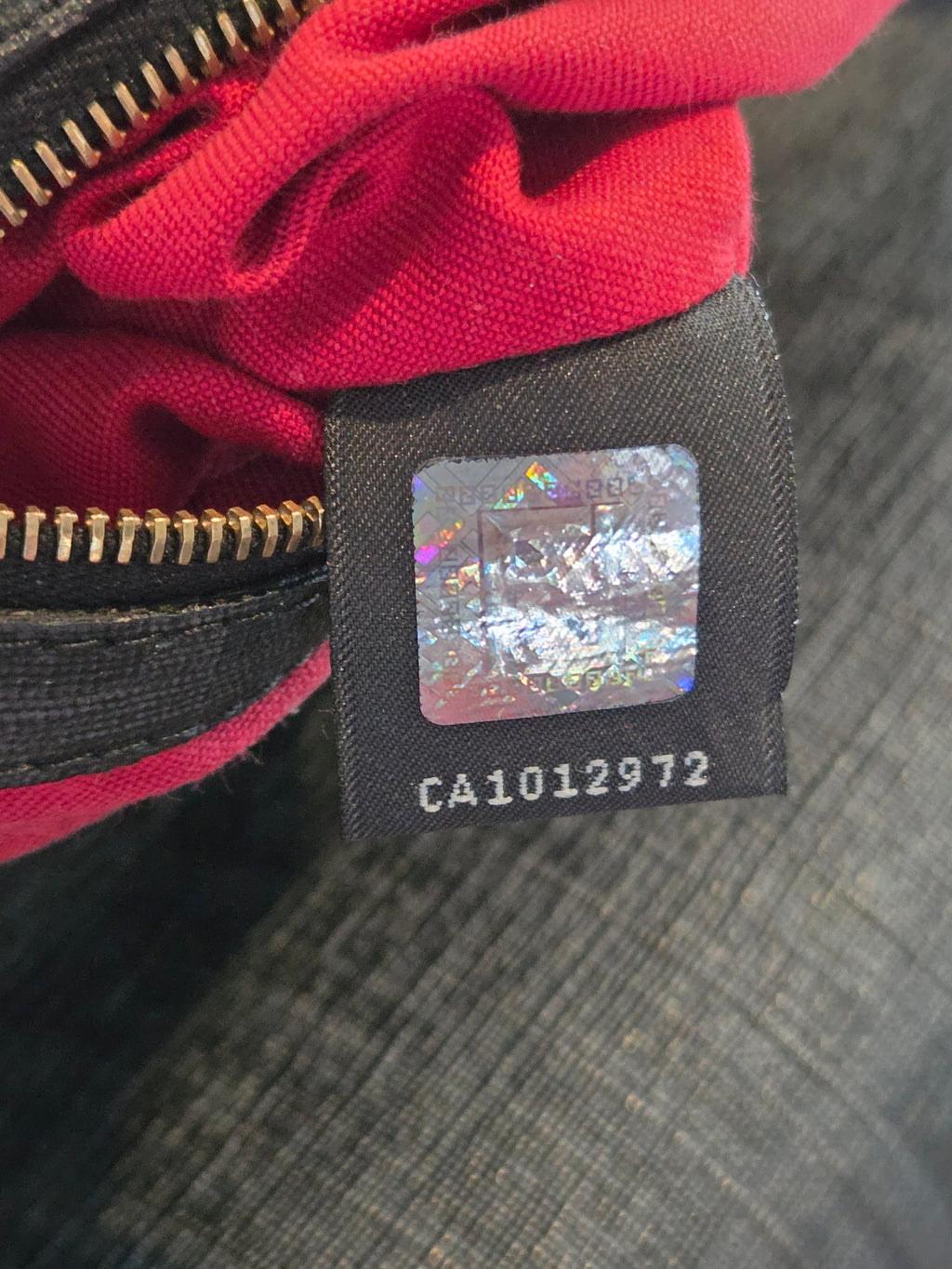 Close-up of a label on a red garment with a blurred background