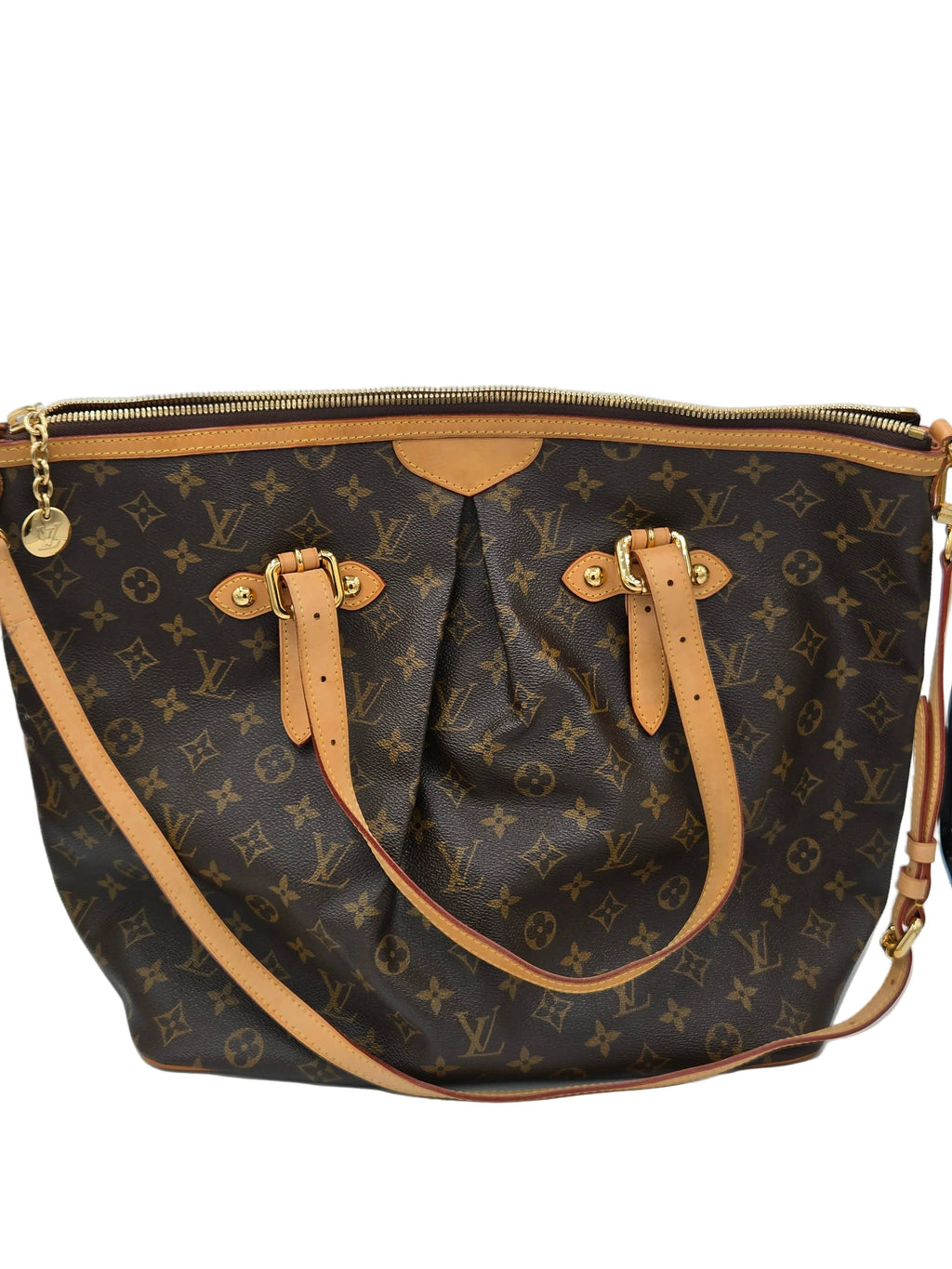 Designer handbag with monogram pattern on a light gray background