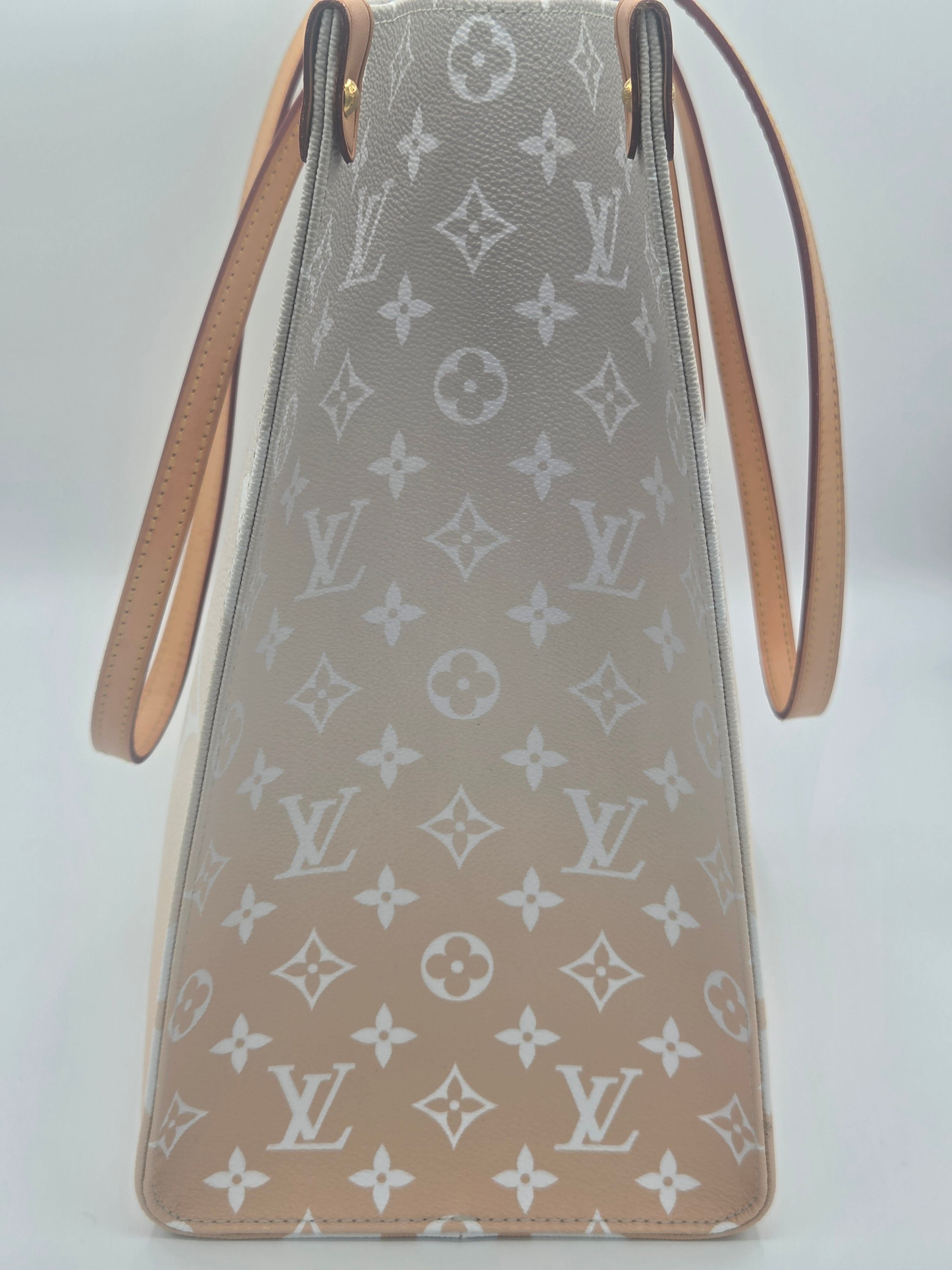Designer handbag with monogram pattern on a light background
