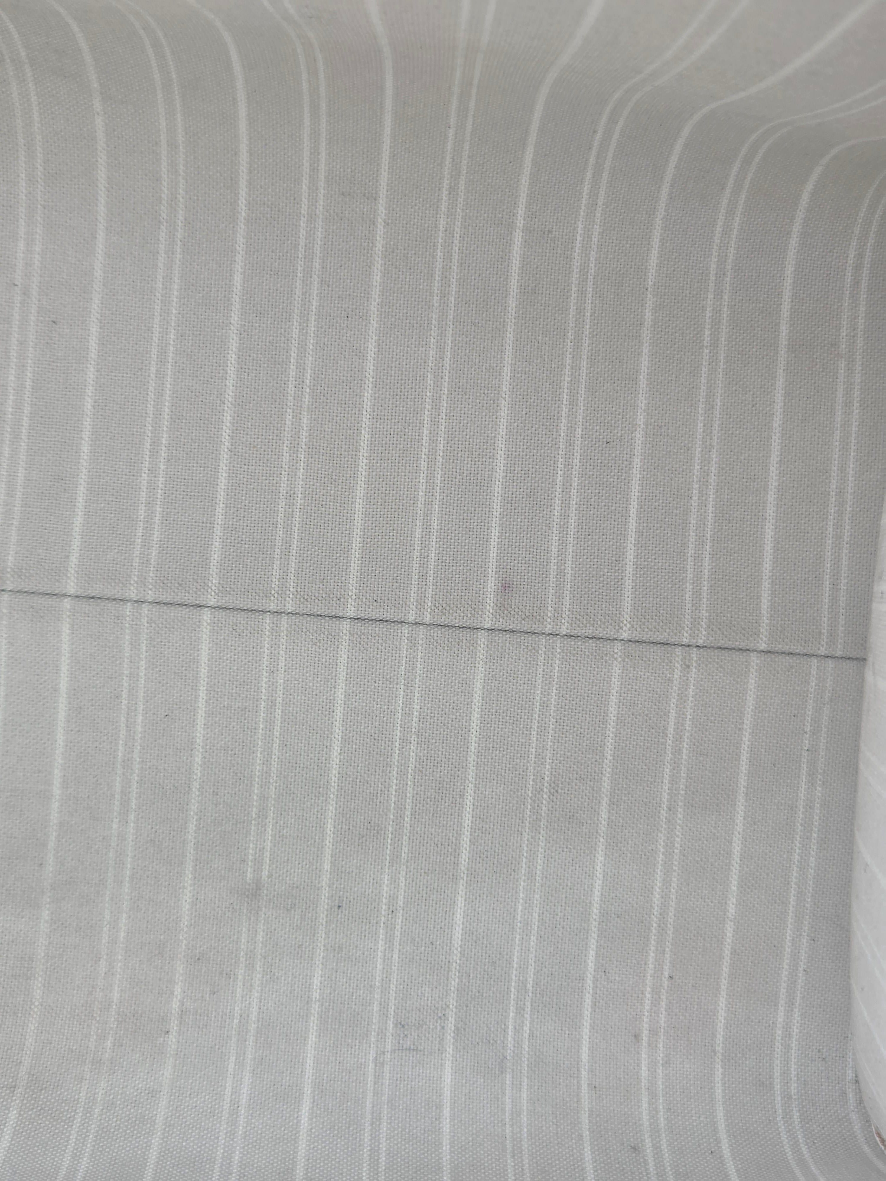 Close-up of gray fabric with subtle texture and lines