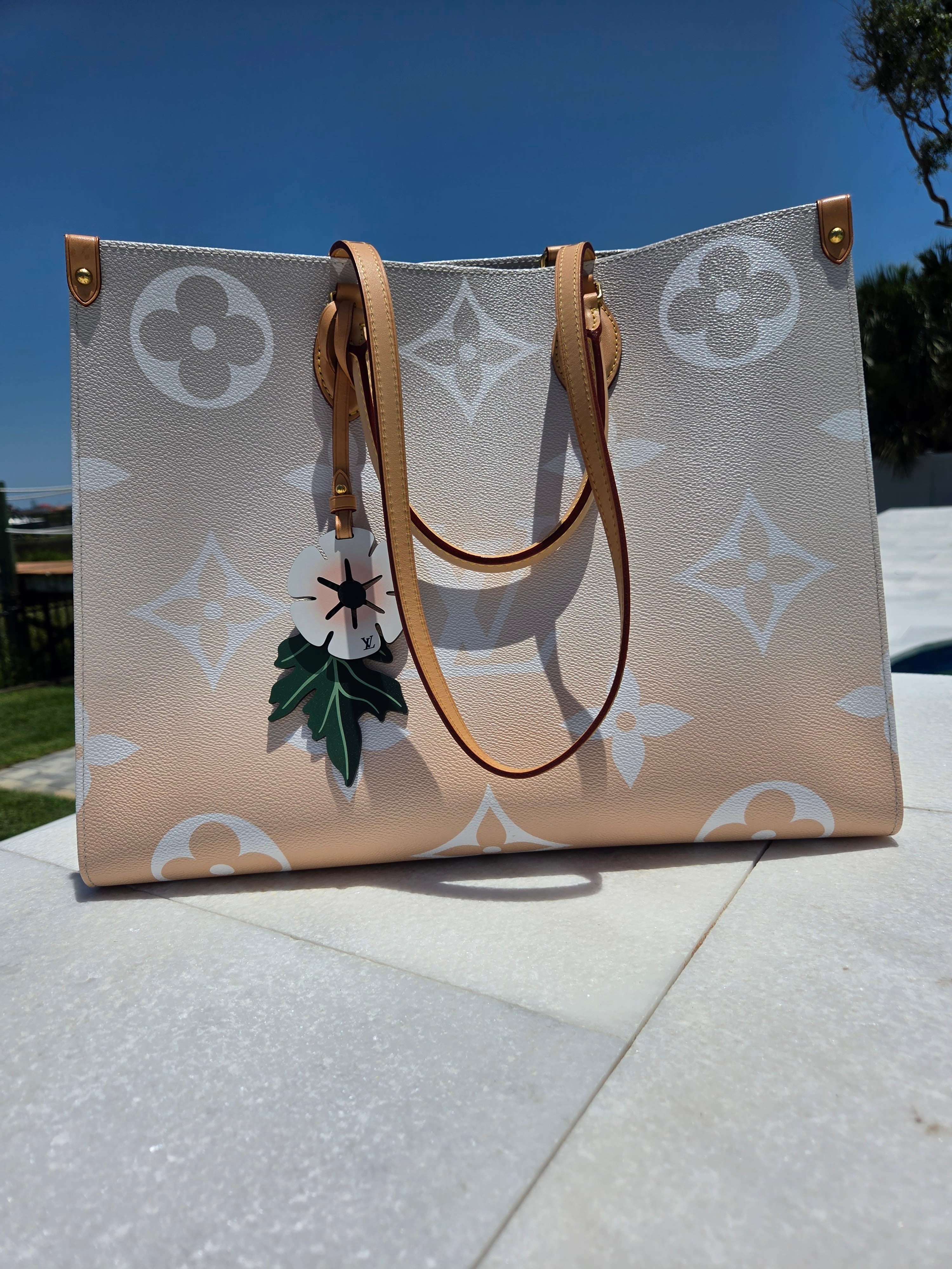 Designer handbag with a pattern on a pavement