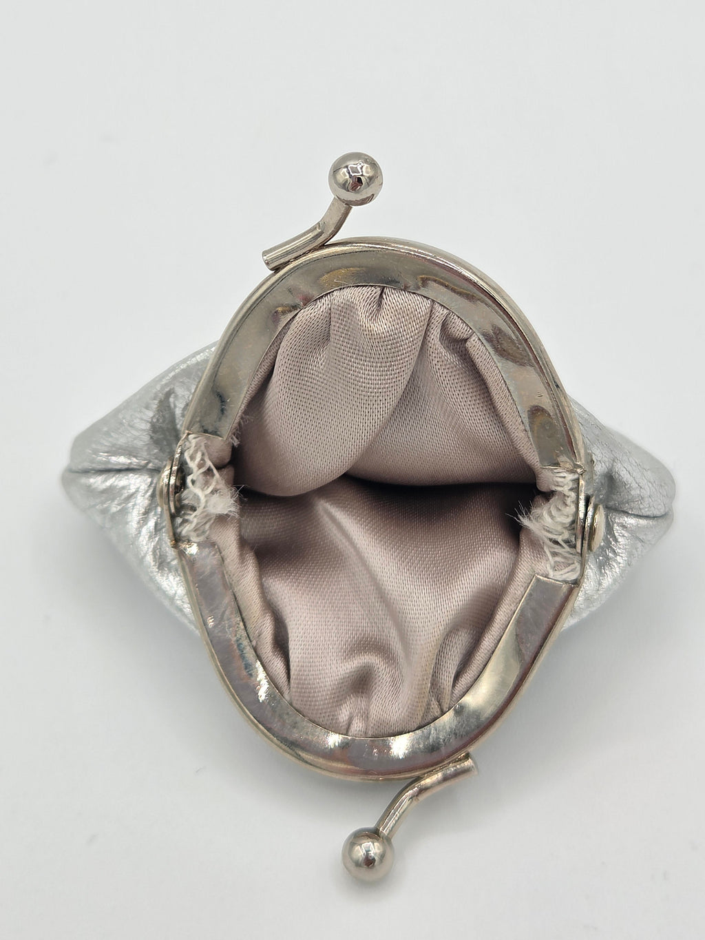 interior view of silver coin pouch