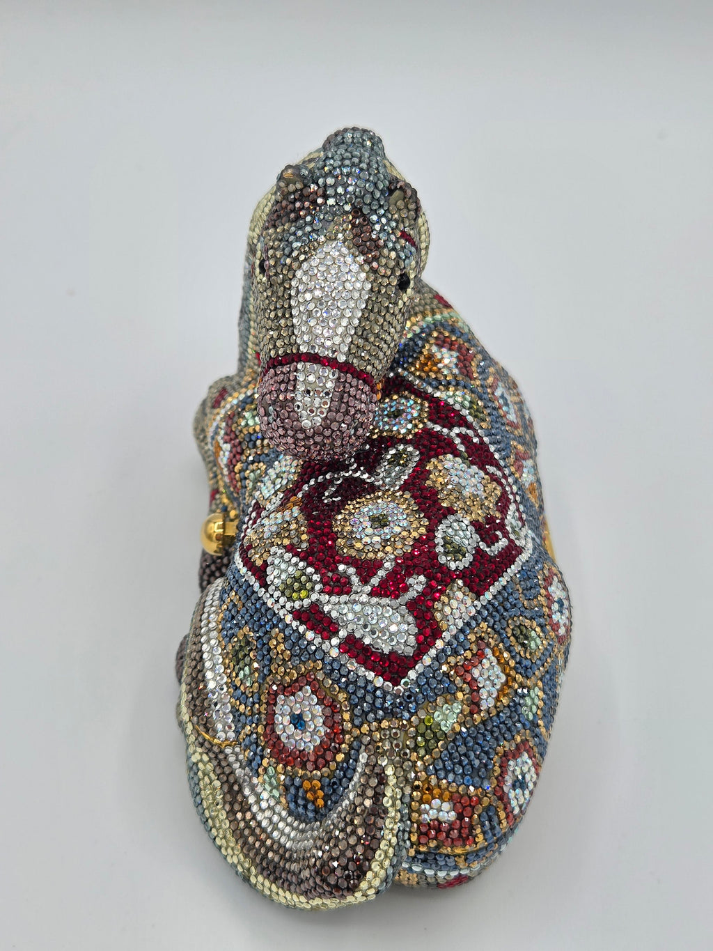 Beaded animal-shaped clutch bag on a light gray background