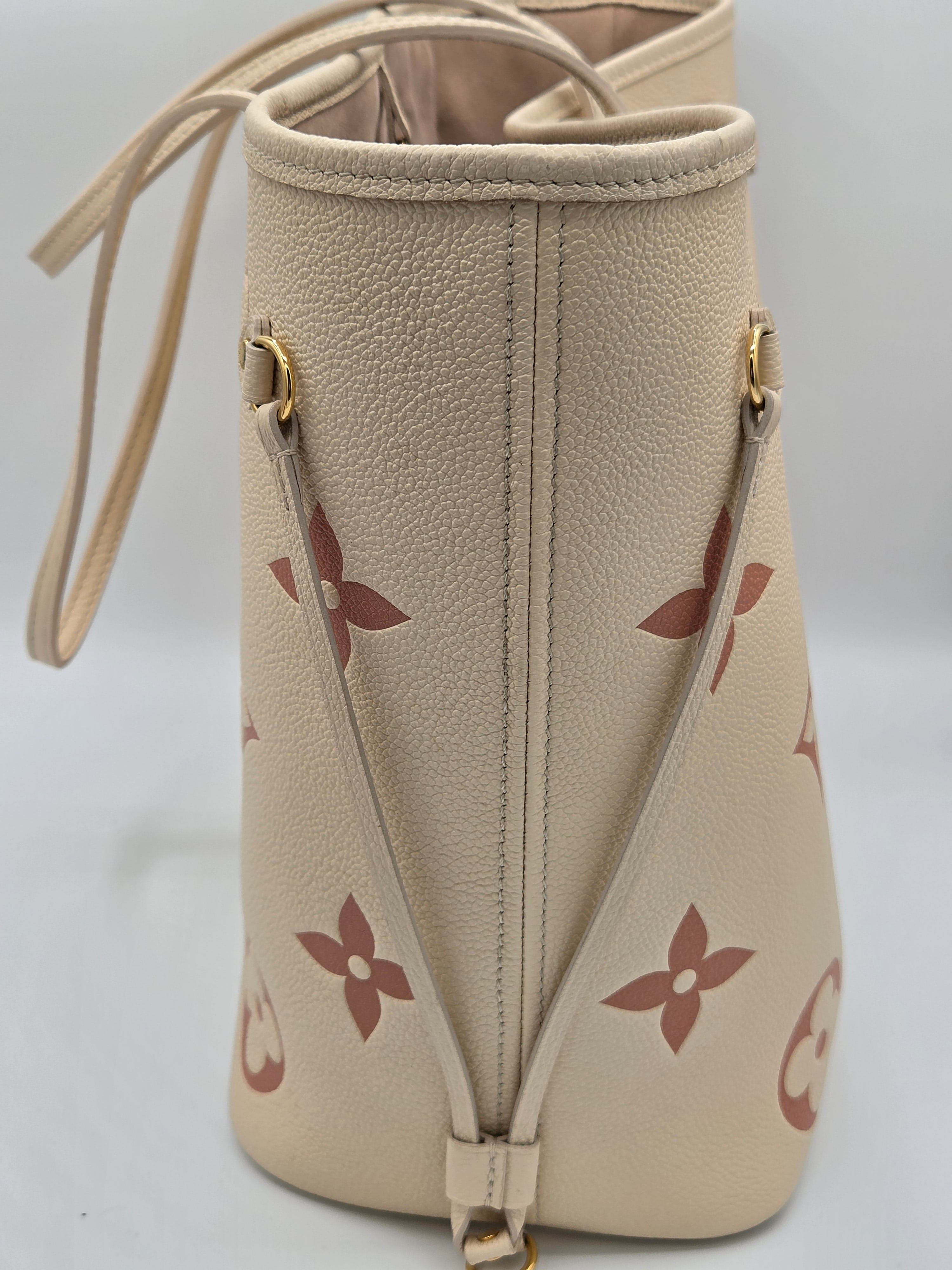 Beige handbag with floral pattern on a light gray background