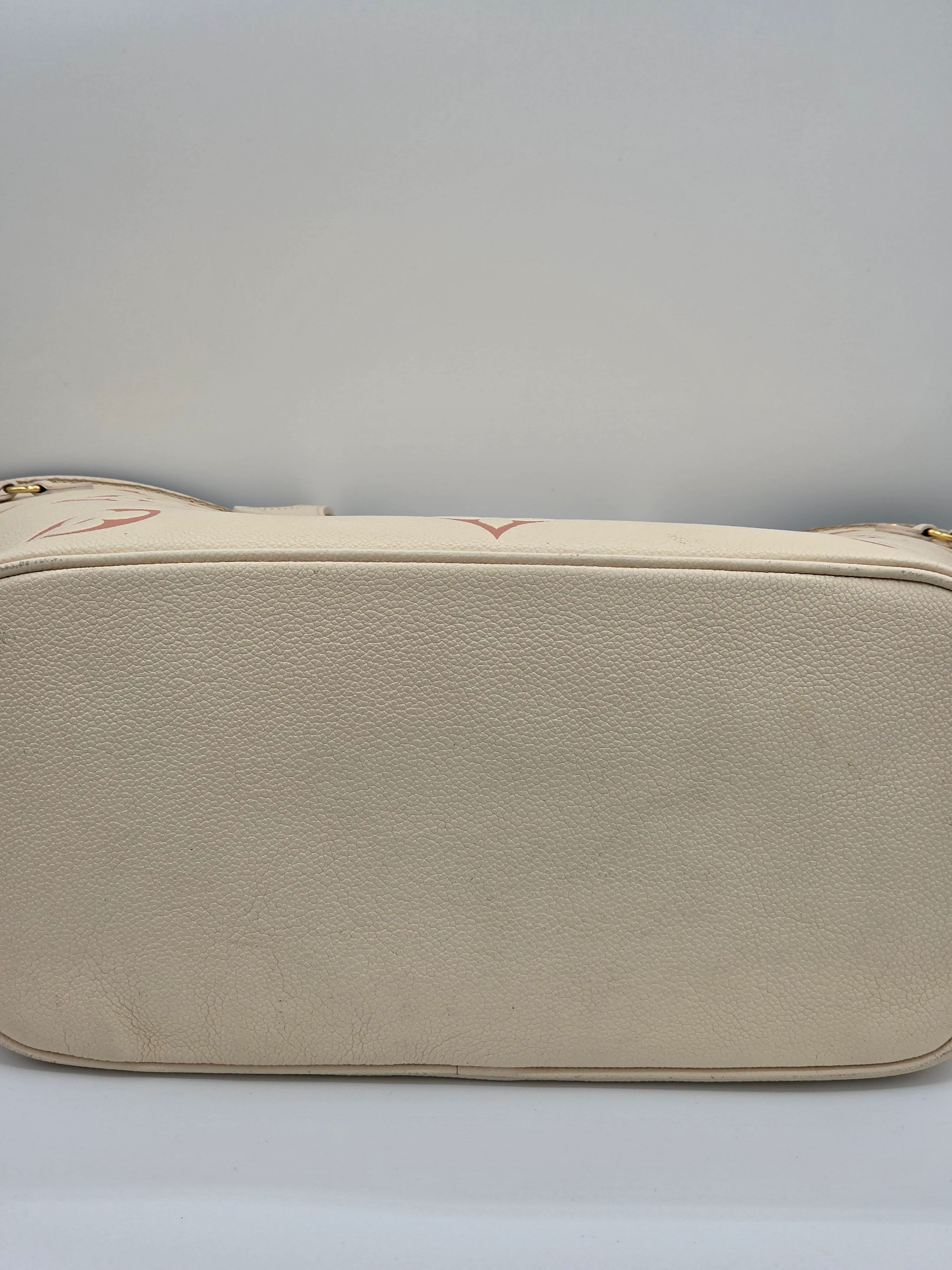 Beige leather wallet on a light gray background