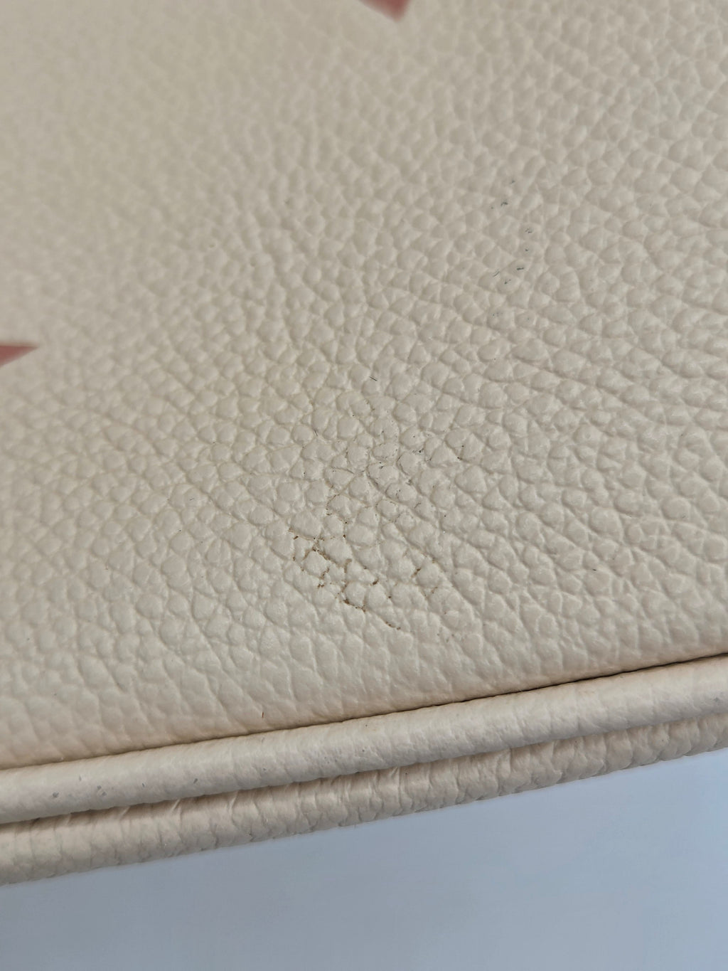 Close-up of beige leather surface with visible texture