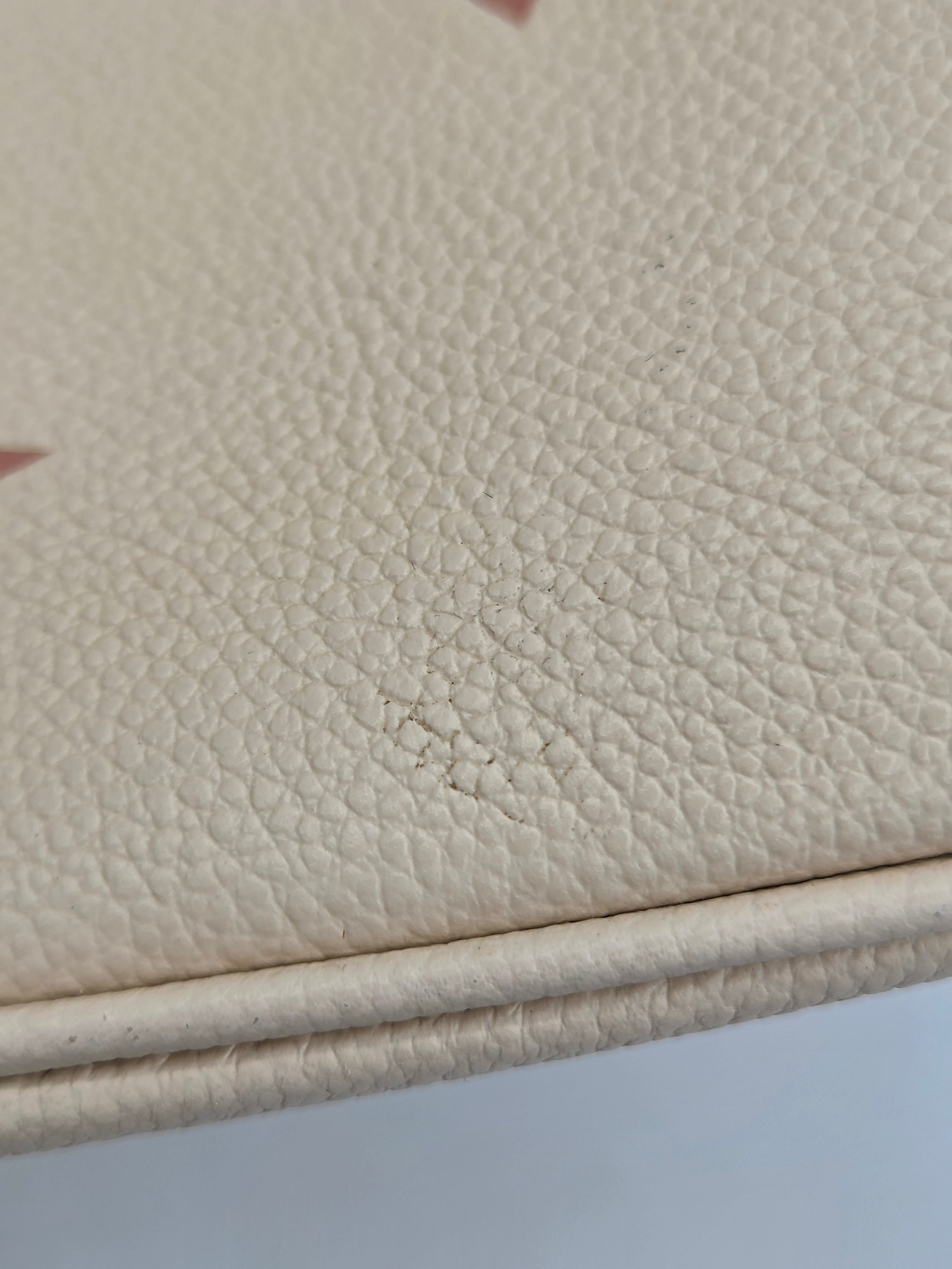 Close-up of beige leather surface with visible texture