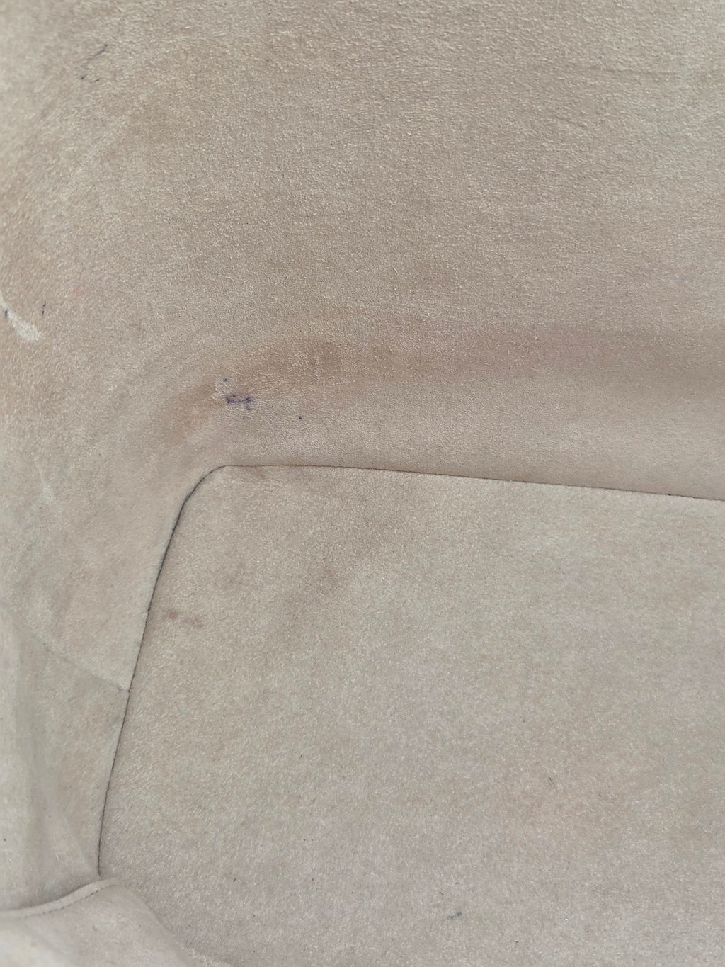 Close-up of a textured beige fabric surface