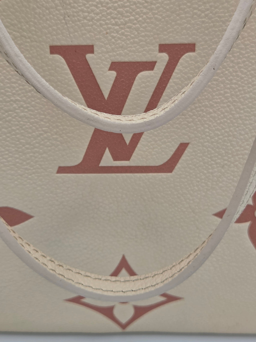 Close-up of a textured surface with a logo and geometric design.