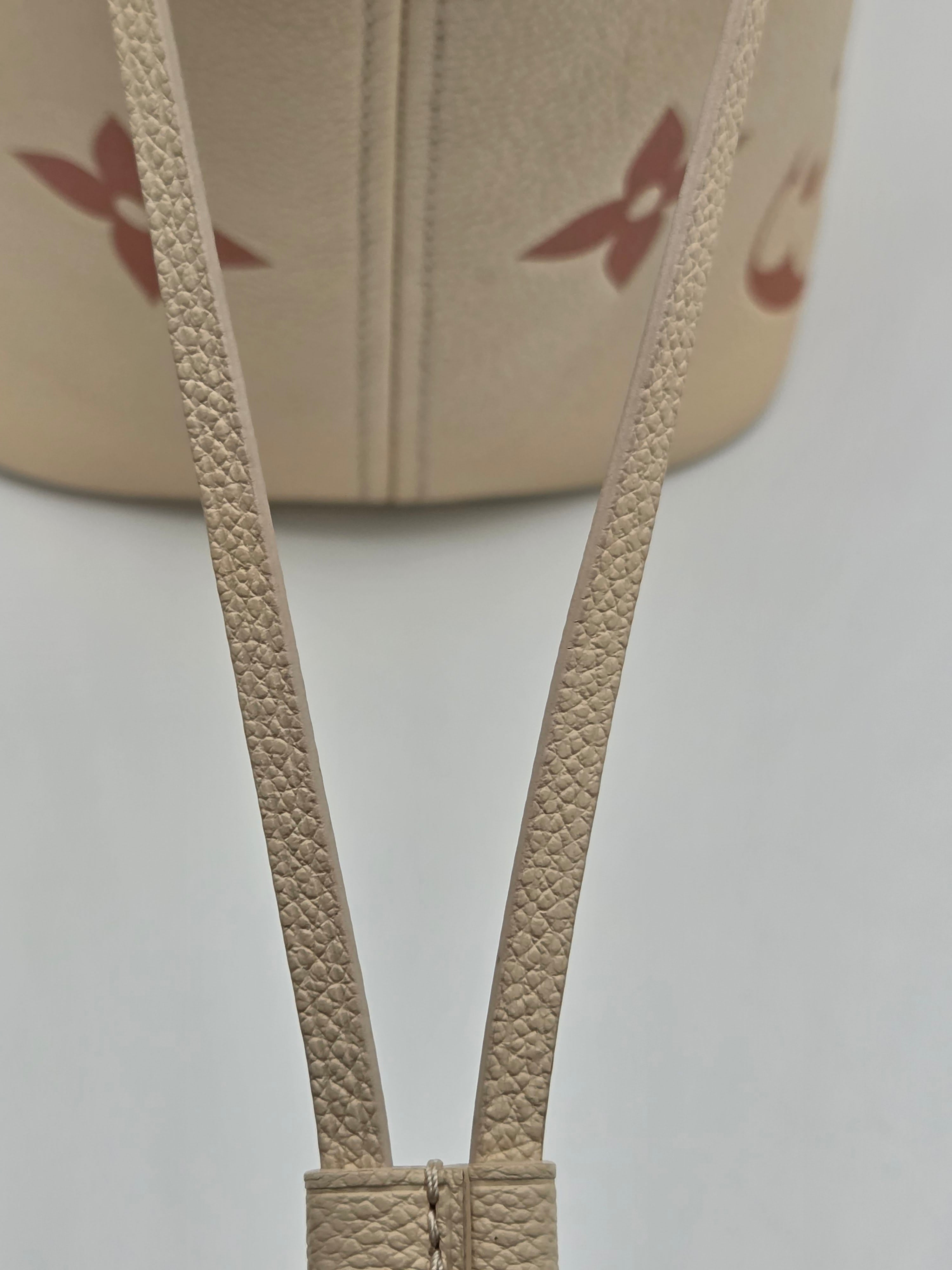 Close-up of beige bra straps with a blurred background