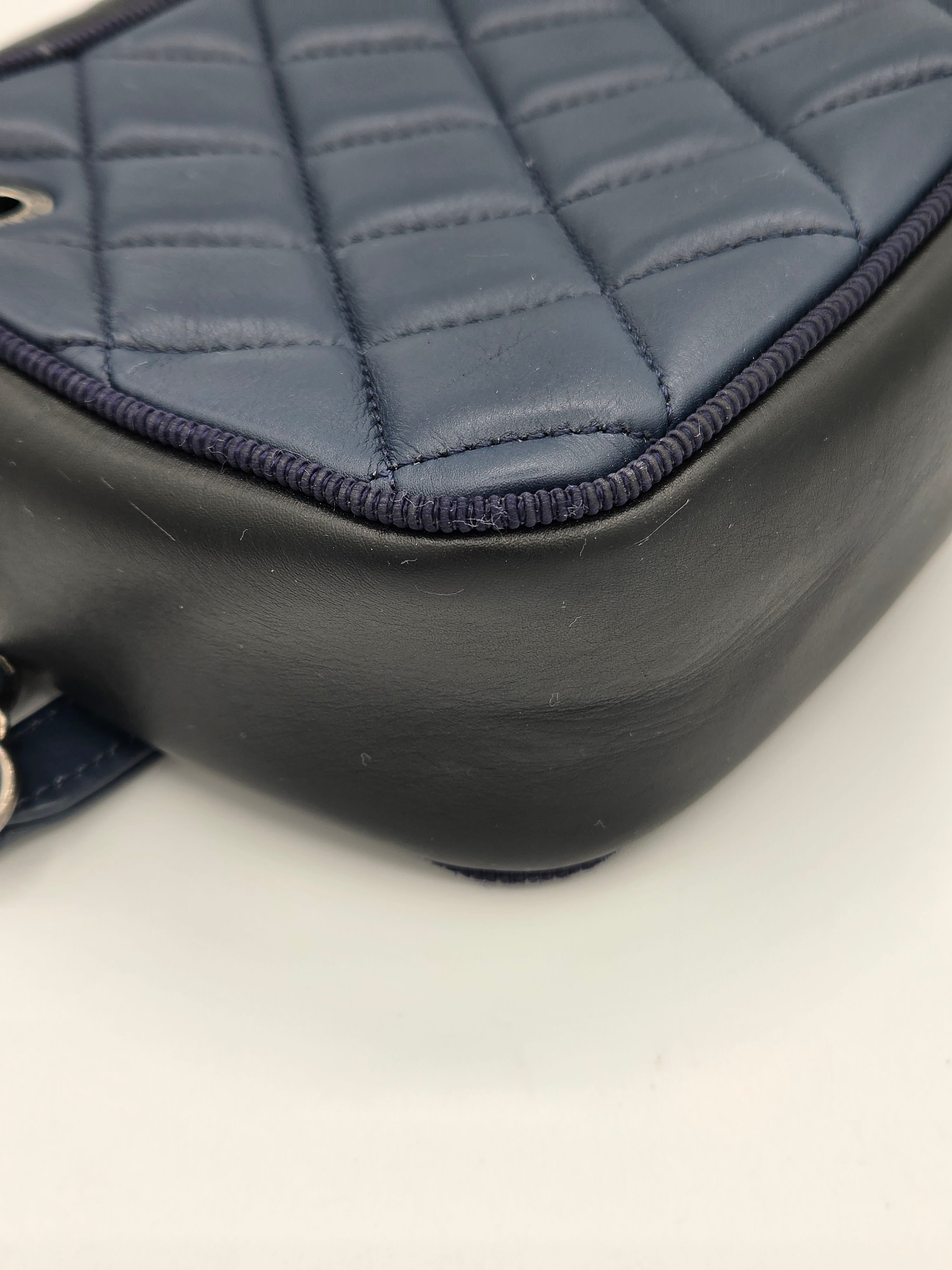 Close-up of a car seat cover with quilted pattern on a white background