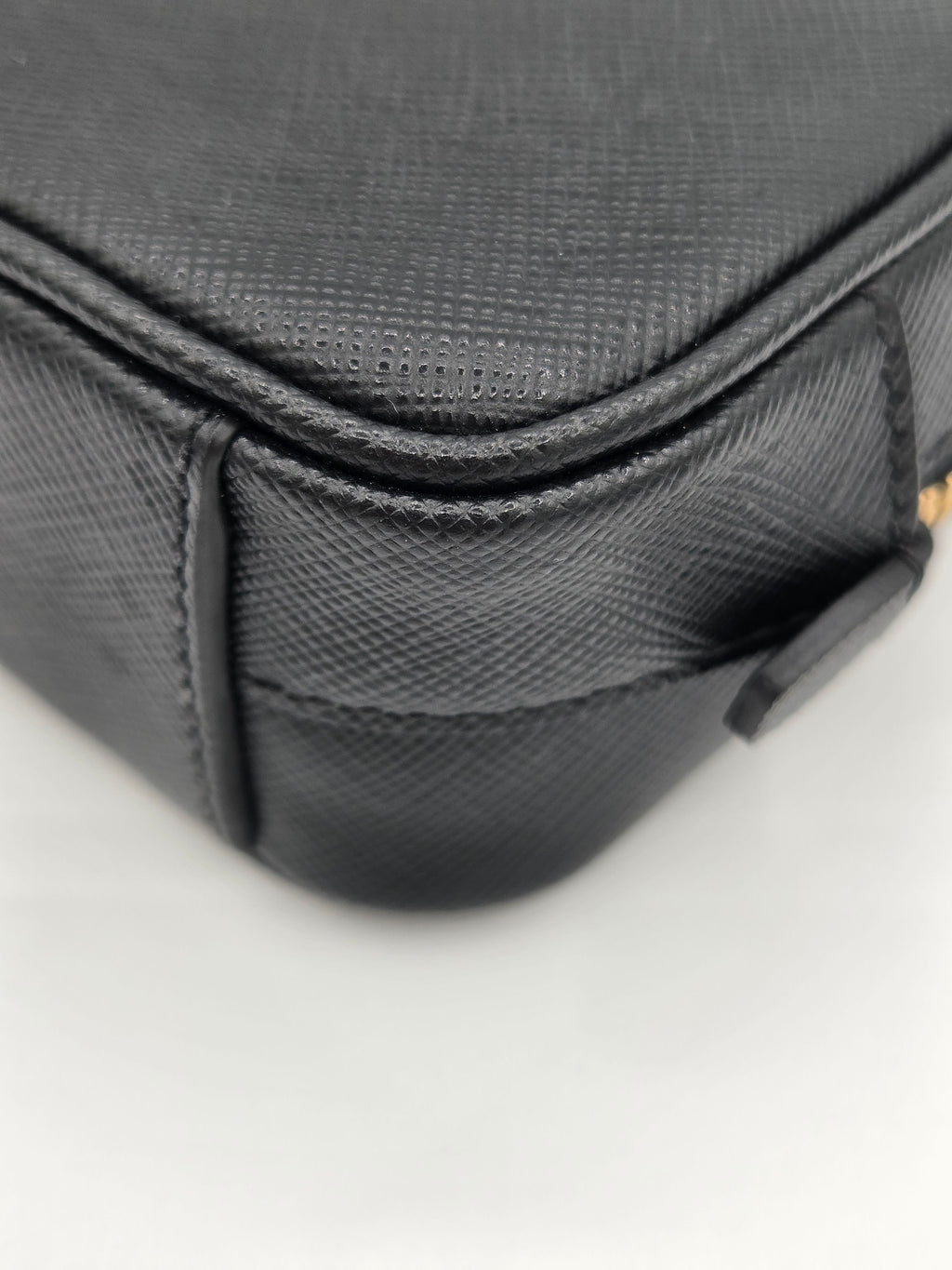 Close-up of a textured black bag on a white background