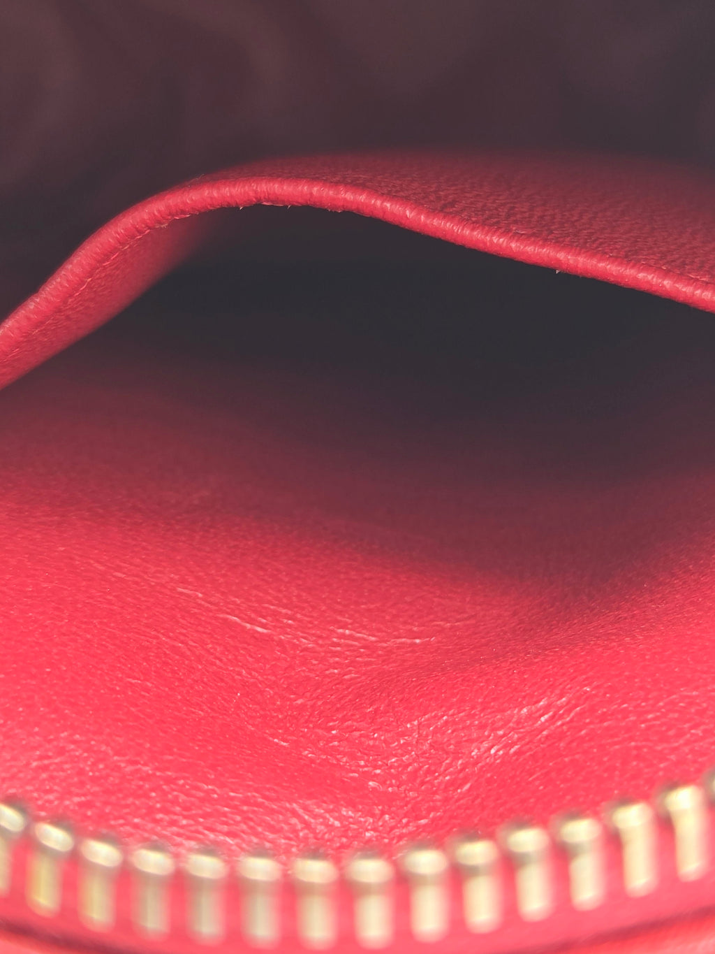 Close-up of a red leather zipper