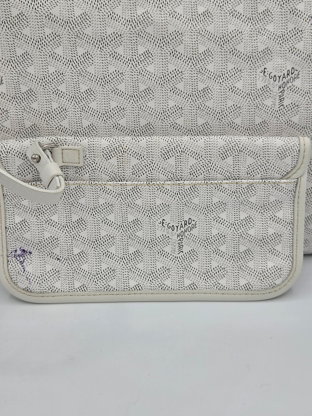 Patterned pouch with a zipper on a light gray background