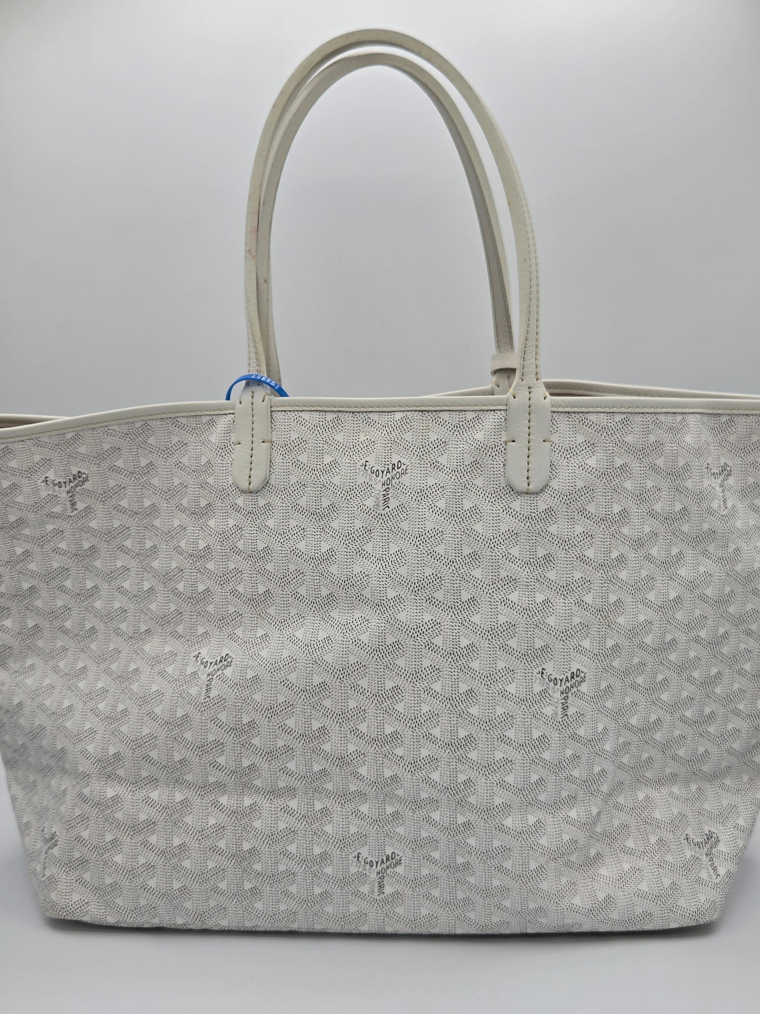 Gray patterned handbag on a light gray background